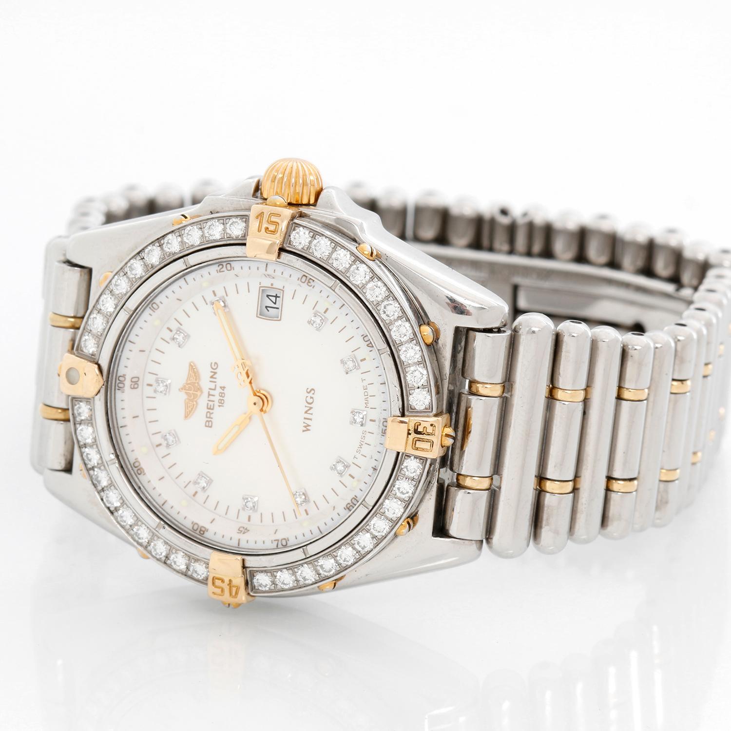 Breitling Wings Lady Steel and Gold Diamond Watch B67350 - Quartz . Stainless steel case with a diamond bezel ( 31 mm ) . Mother of Pearl dial with diamond hour markers . Stainless steel and gold band with a double deployant buckle . Pre-owned with