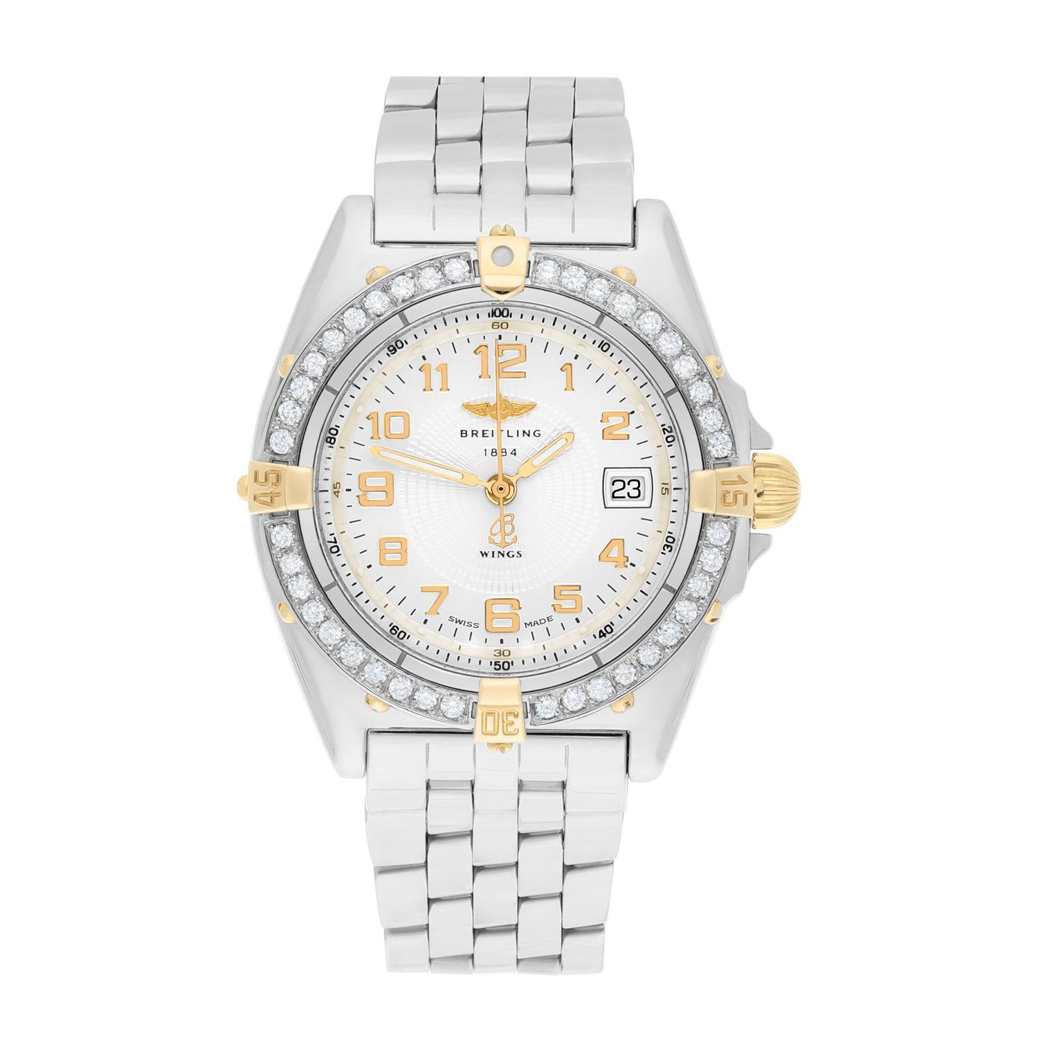 Brand: Breitling 
Series: Wings  
Model: B67050
Case Diameter: 31 mm
Bracelet: Stainless steel
Bezel: Custom diamond set
Dial: Ivory dial
The sale includes a jewelry watch box and an appraisal certificate which states the watch's