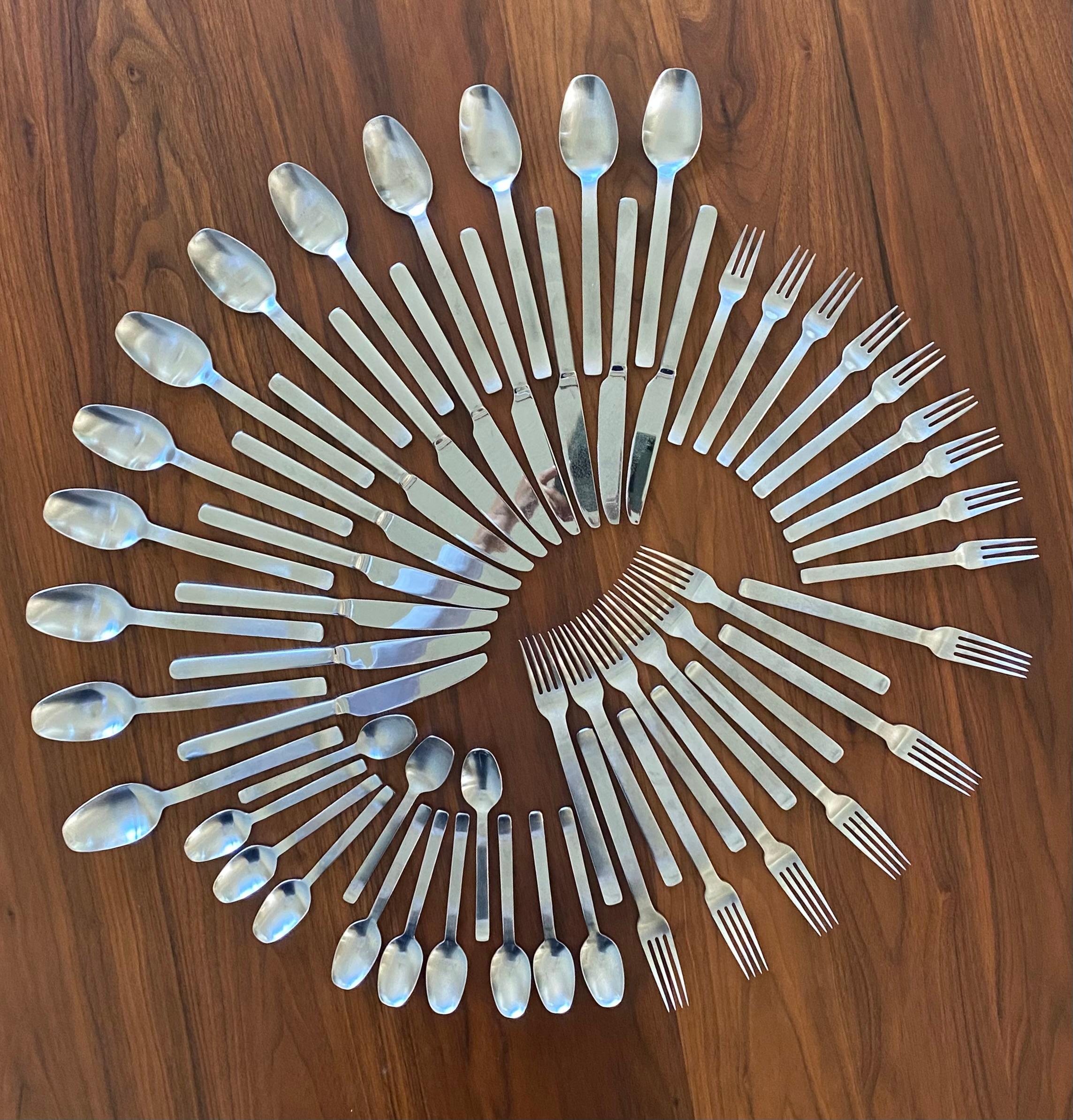 Modernist clean German-designed and made in 18/10 stainless steel flatware service for 9 (36 main pieces). There are three extra pieces for all except the dessert forks for a total of 45 pieces.

Bremer Silberschmiede Tradition (BSF) is under the