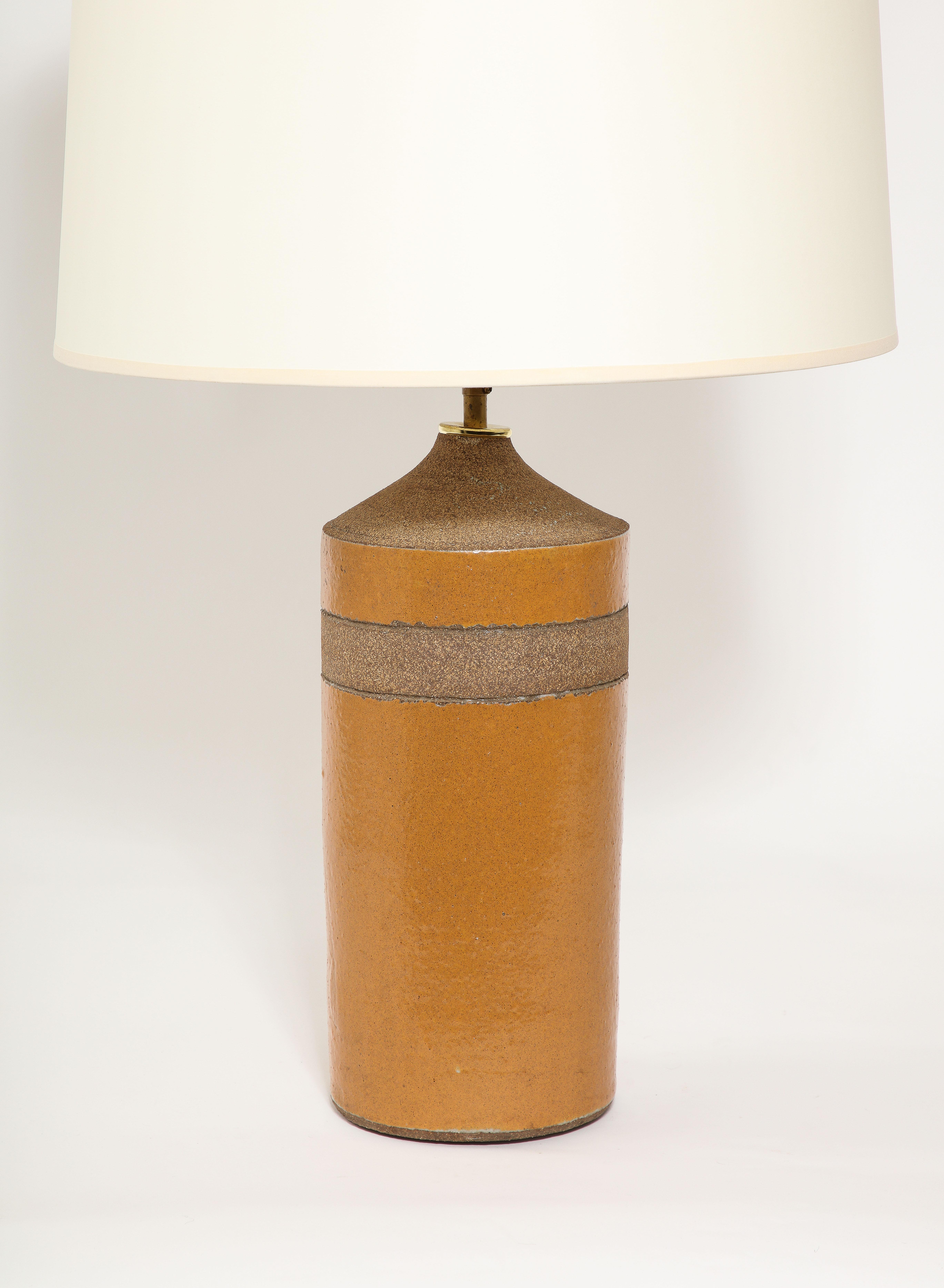 Earthenware table lamp with alternating glazed and rough textures.



21x7 Base Only