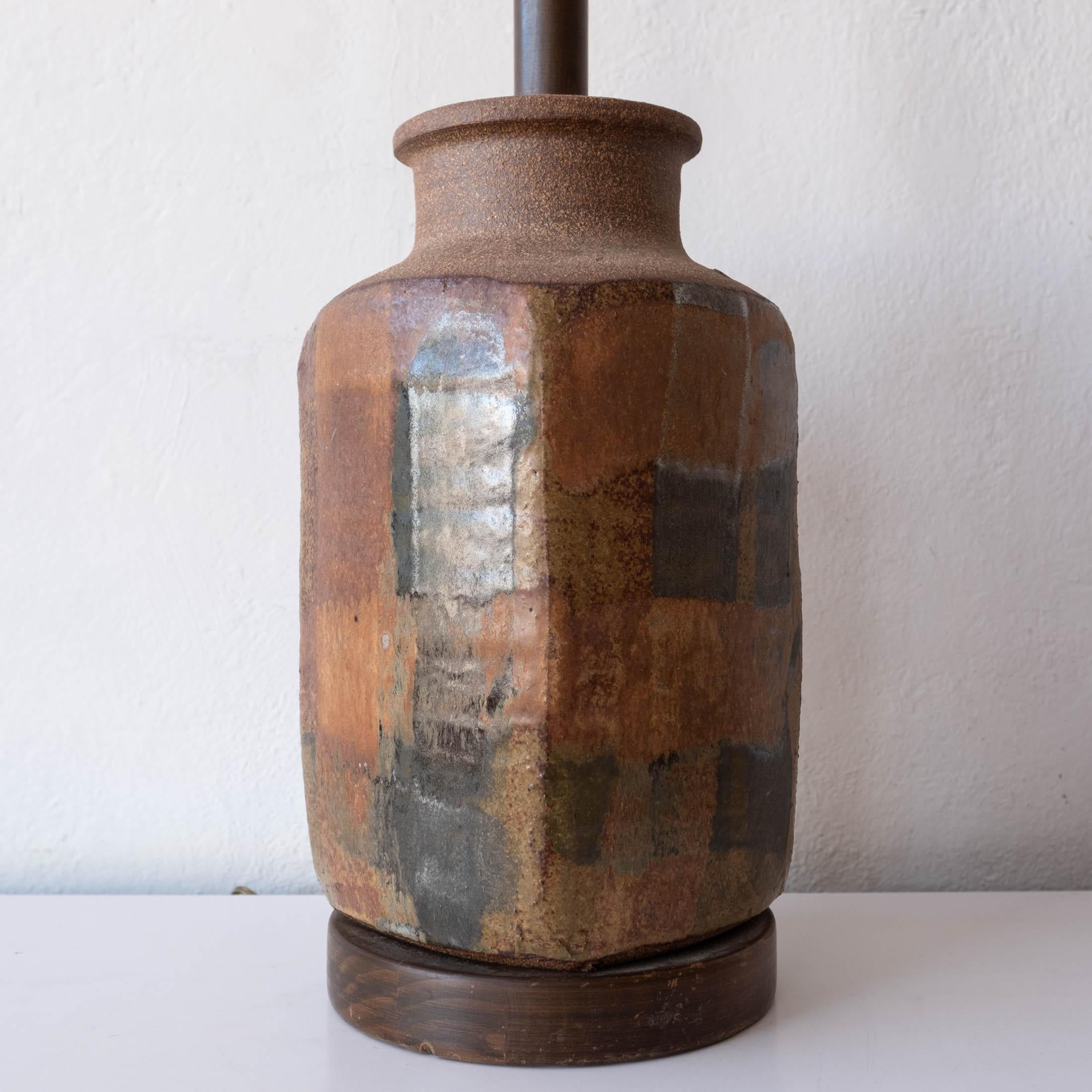 Glazed stoneware lamp with wood base by California artist Brent Bennett.  1970s

Lamp with hardware is 7