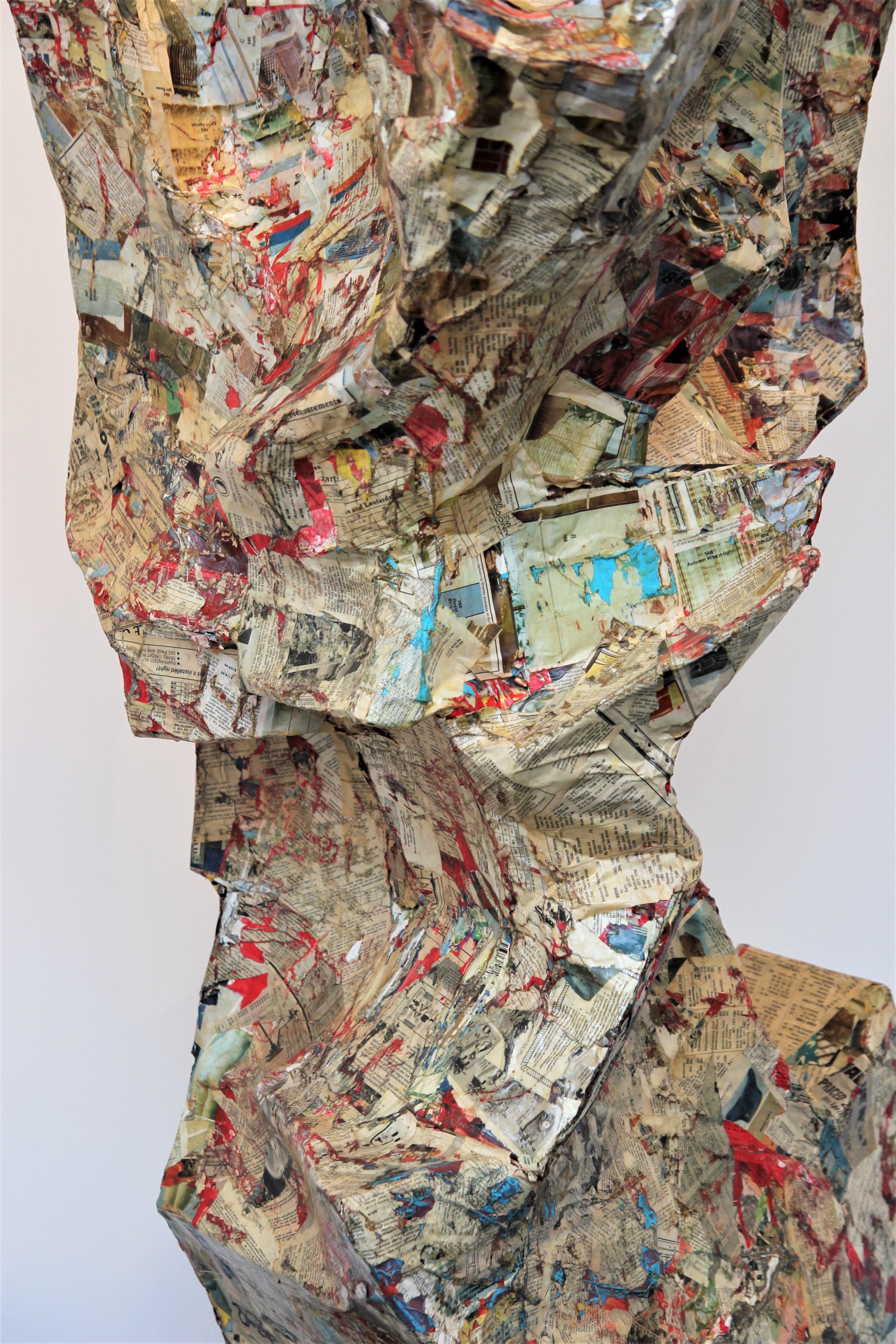 Colorful abstract contemporary collage sculpture that incorporates pages from 1960 Sears catalogues, cardboard, wood, concrete, acrylic paint, and wood glue. The organic, amorphous form features a primarily cream surface with accents of bright reds