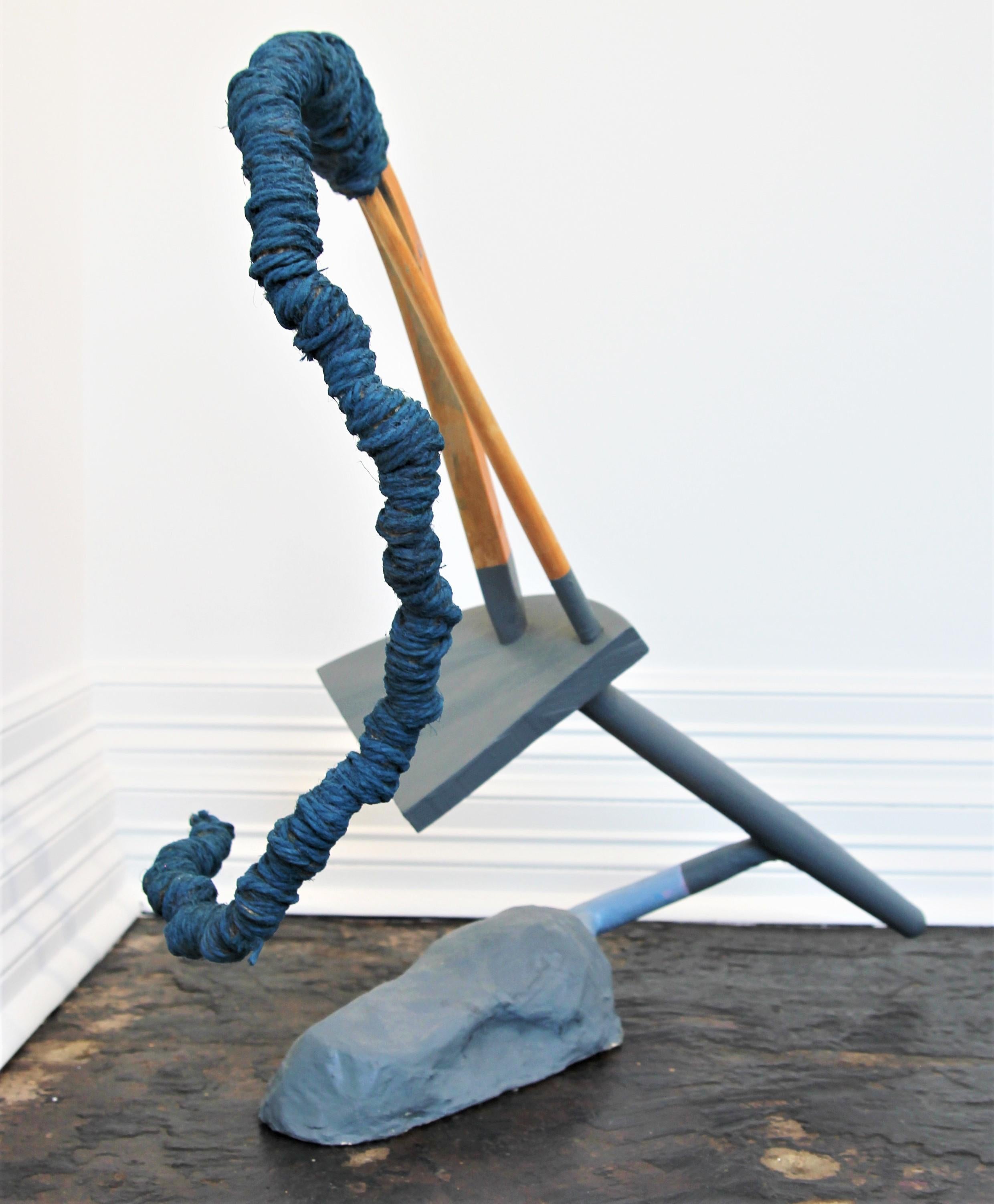 Abstract contemporary collage sculpture that incorporates found furniture, jute, concrete, and paint. The amorphous form features a primarily blue 