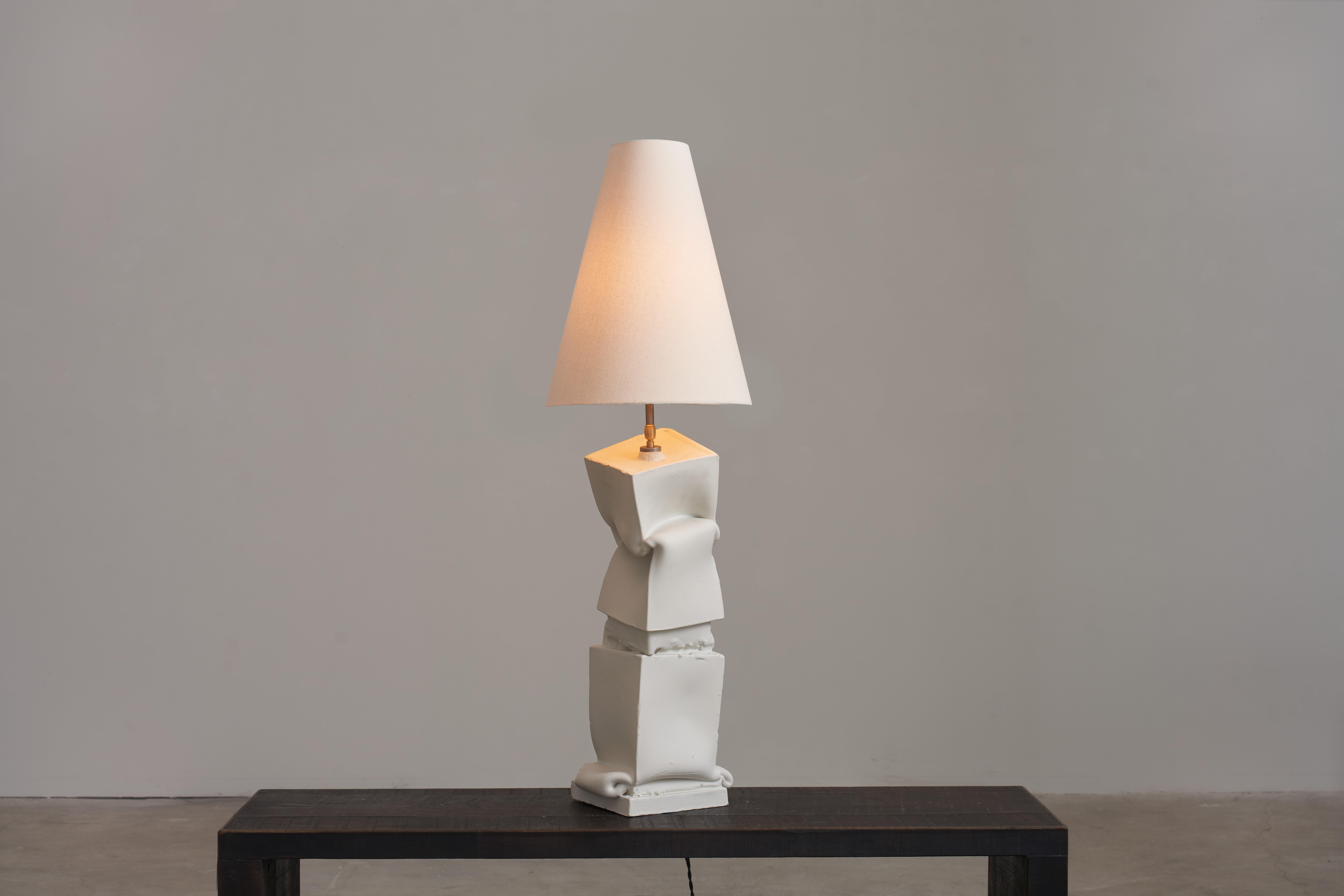 Breganze and Fara Table Lamp by Jenna Basso Pietrobon
Dimensions: W 25 x D 18 x H 102 cm
Materials: Ceramic, Textile, Brass.
Weight: 4 kg

Jenna Basso Pietrobon, born in 1986, is an artist whose work delves into societal issues through the lens of