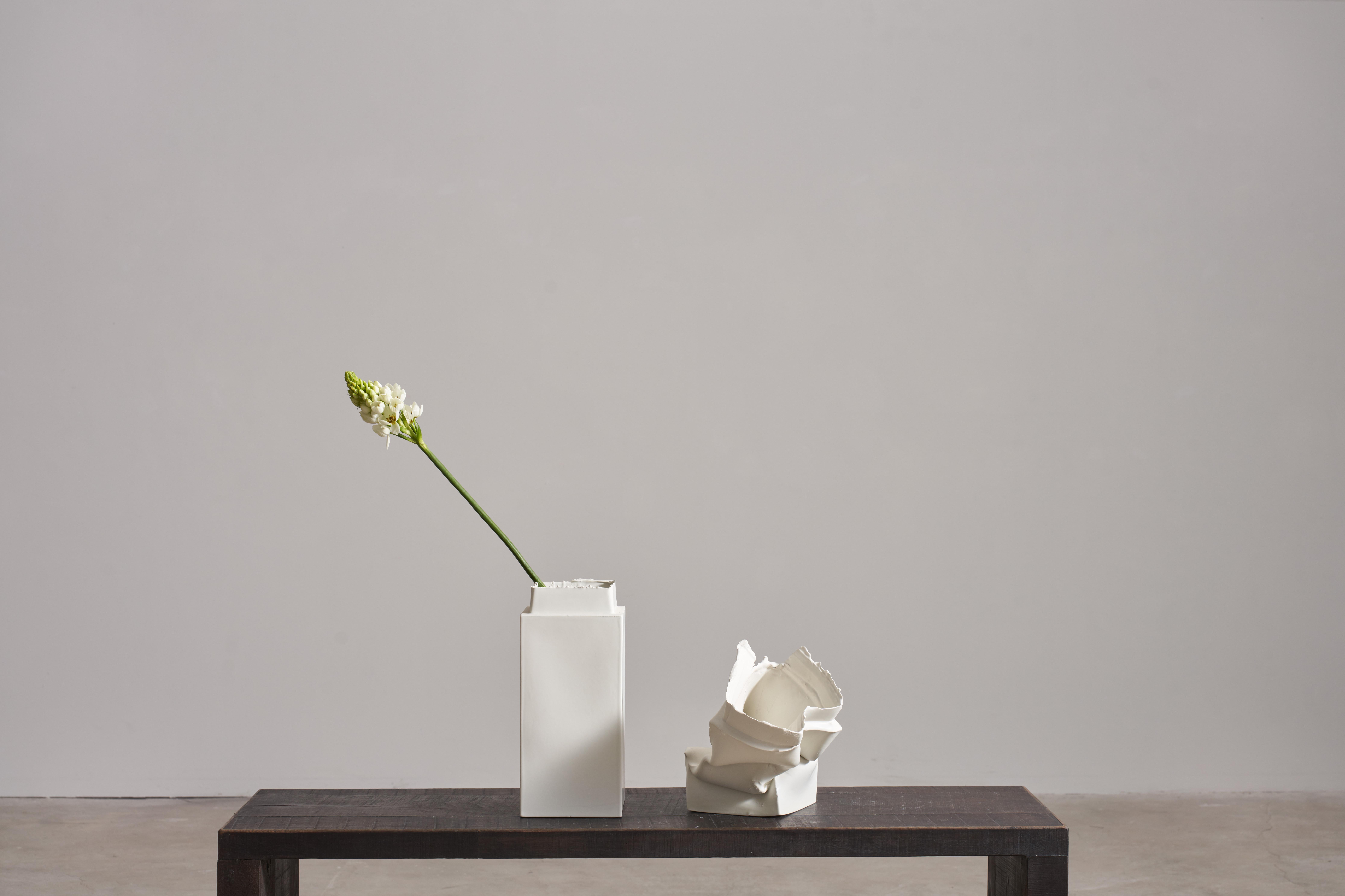 The Brenta vases is part of a project entitled Break the Mold by artist Jenna Basso Pietrobon. Each vase is unique, you will receive one straight and one collapsed. The standard glaze uses an off-white semi matte and other glaze colors upon