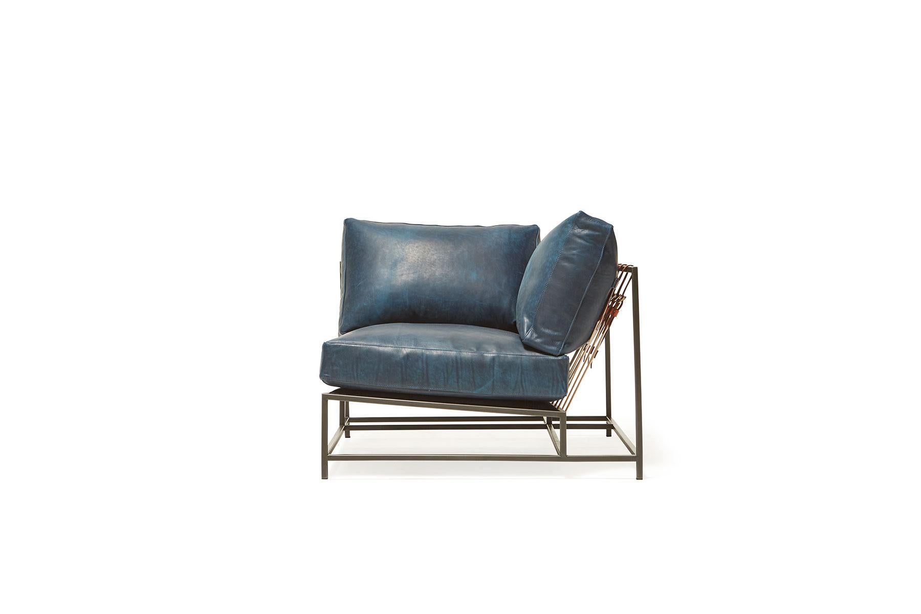 The Inheritance Corner chair can be used as a standalone piece, or as part of a modular sectional with other Inheritance pieces. 

This variation is upholstered in Brentwood Navy leather by Moore & Giles. The foam seat cushions have been wrapped