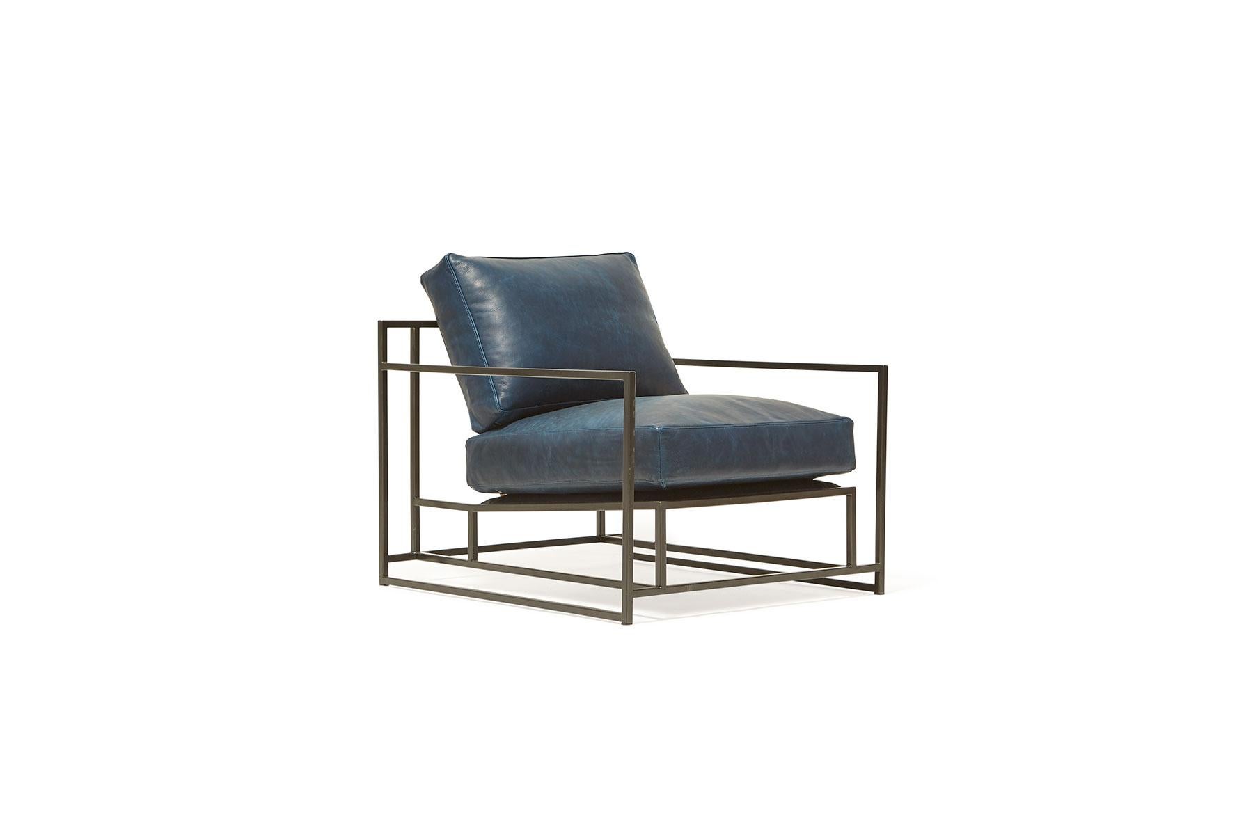 The Inheritance Armchair by Stephen Kenn is as comfortable as it is unique. The design features an exposed construction composed of three elements - a steel frame, plush upholstery, and supportive belts. The deep seating area is perfect for a