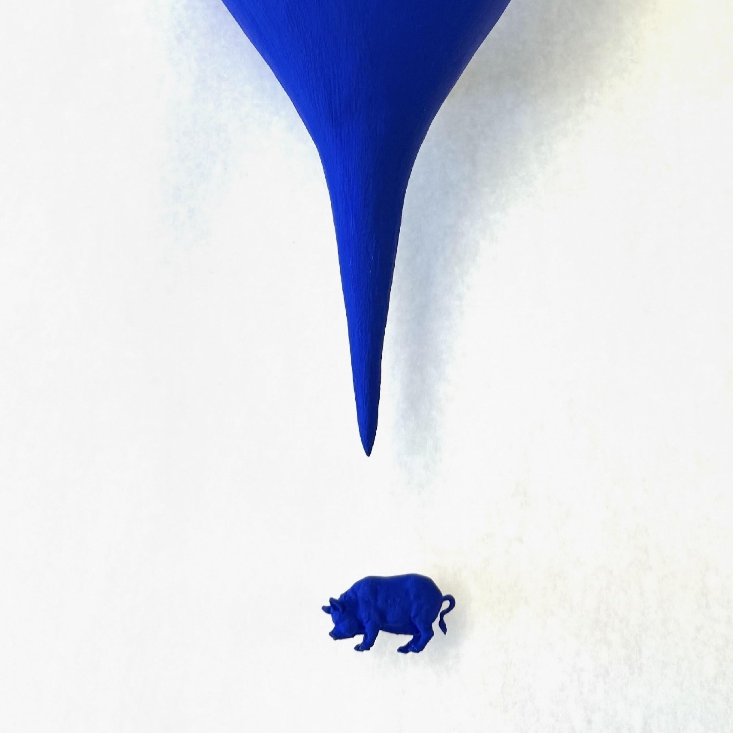 This artwork commands attention with its striking simplicity and bold use of the Klein Blue color. Dominating the composition is an exclamation shaped, below, a diminutive blue pig, creating a striking juxtaposition in size and emphasizing themes of