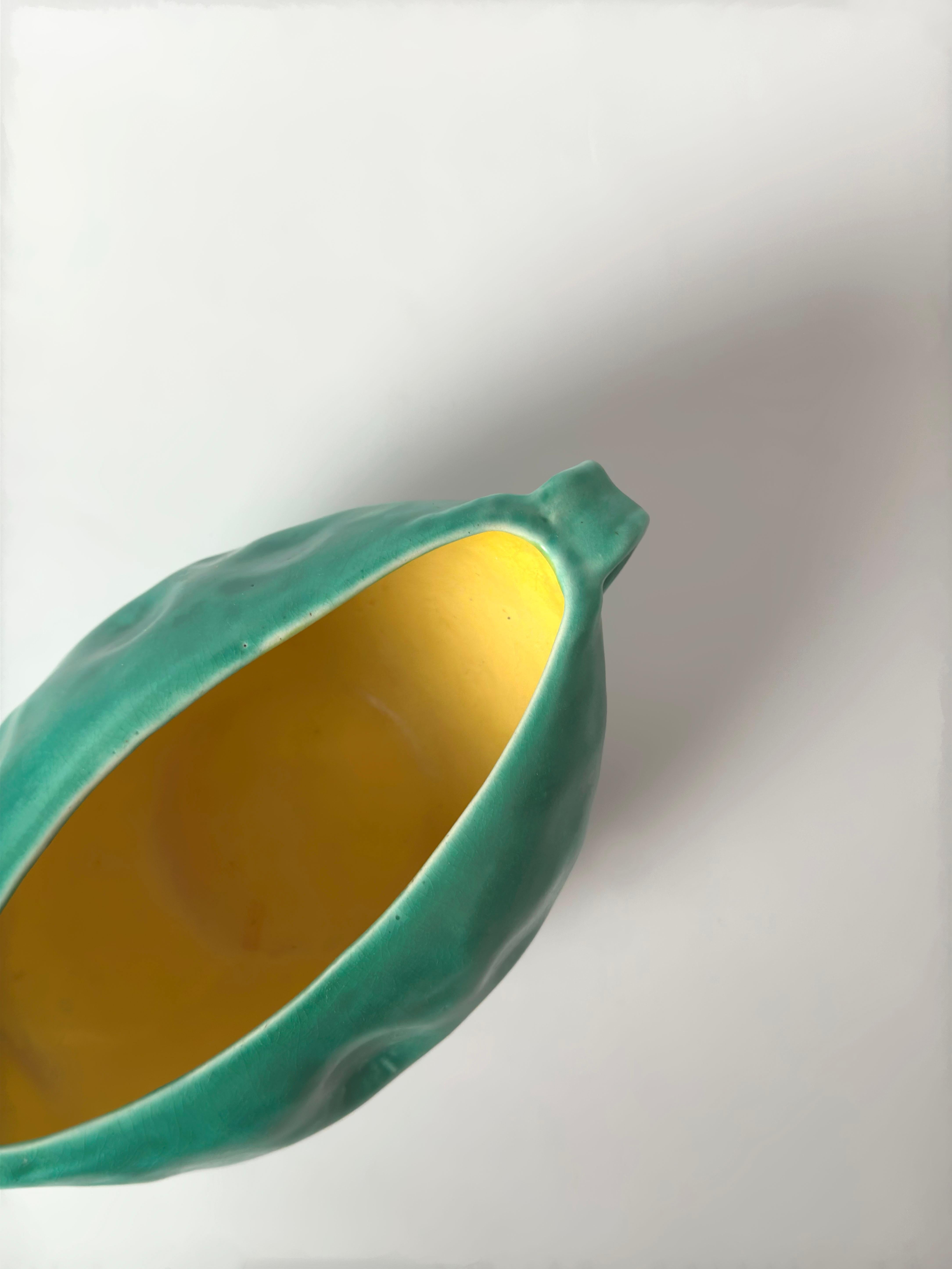 A small yet sculpturally expressive planter by Bretby Art Pottery, model number 1616, produced in England during the 1930s. Reflecting the company’s distinctive take on Arts and Crafts-era design, this piece combines moulded industrial technique