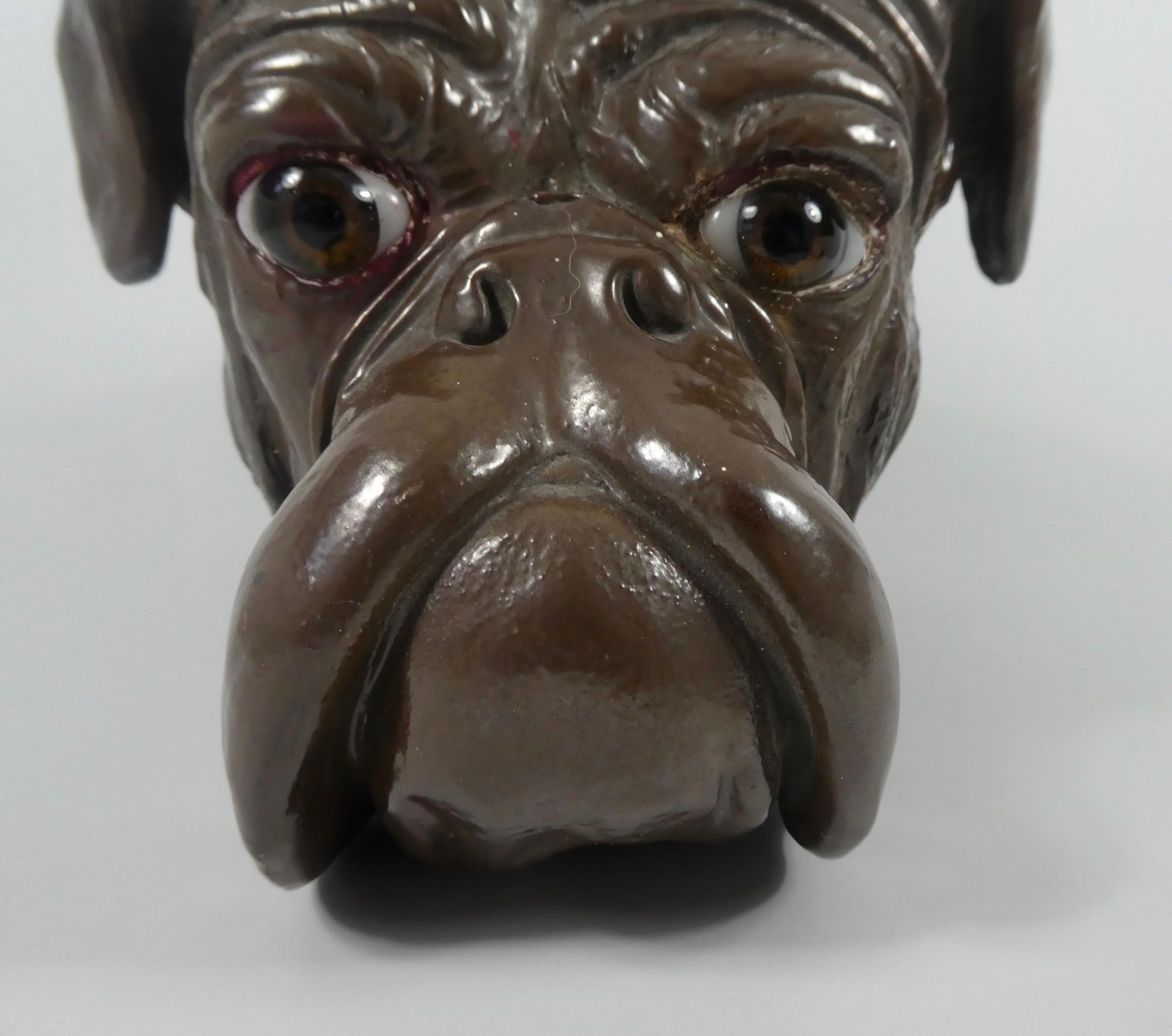 A large Bretby pottery bust of a bull dog, circa 1890. The finely potted bust, painted in naturalistic style, and having inset glass eyes. He is wearing a studded collar, which has a nameplate inscribed ‘Tom Crossley, Lyn Dene,