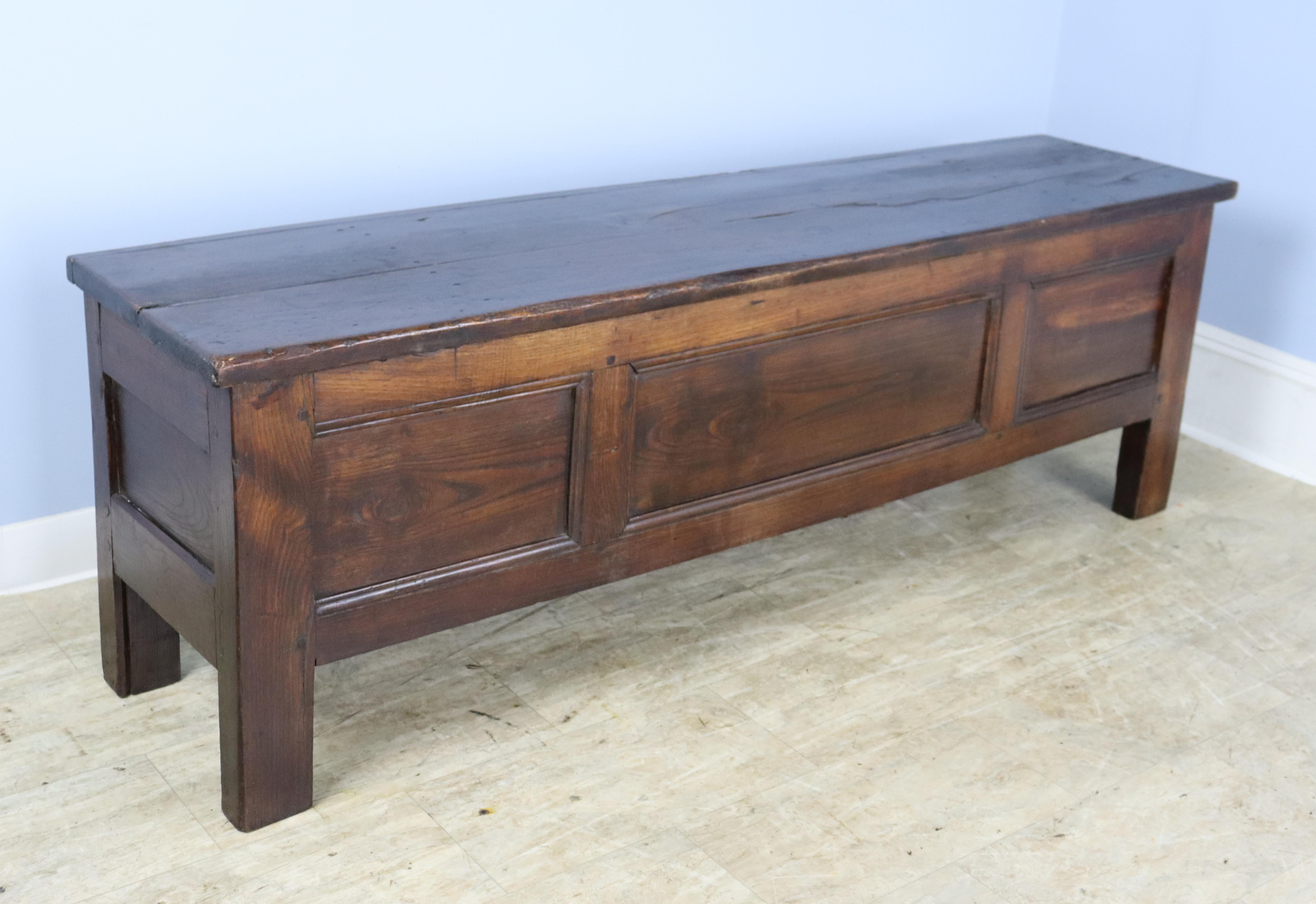 This is a terrific multipurpose piece, to be used at the end of the bed or up against a wall, as storage and a seat, and sometimes as a long narrow coffee table when there is just a narrow space available in front of a sofa. Lovely patinated