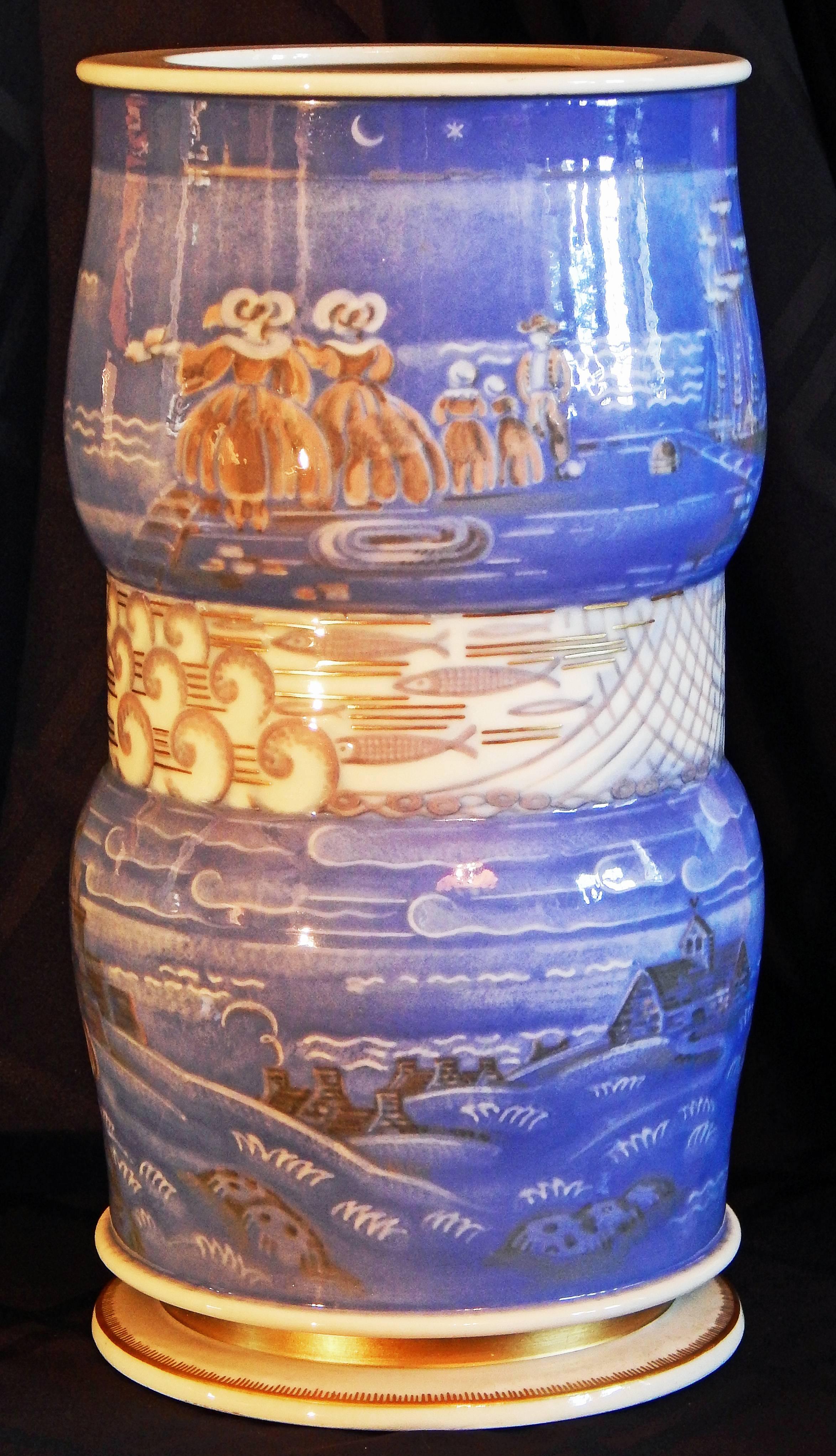 One of the finest pieces of Art Deco porcelain we have ever seen, and probably the greatest work ever executed by Adrien Leduc for Sevres, this large double-gourd vase depicts in great detail scenes from the life of a Breton village along the sea.