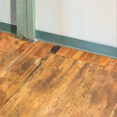 Hallway Floor, Woodgrain Floorboards, Teal Baseboard, White Room Interior Scene