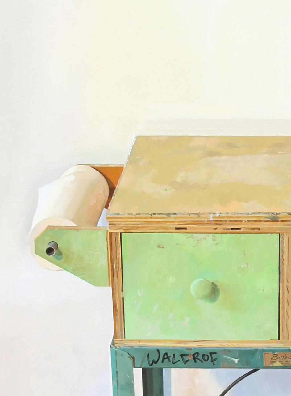 A nearly photo-real representational painting of the artist's studio and painting cart lushly painted in buttery oil paint. Containers of painting supplies can be seen on the lower shelf, light green drawers and a wooden tabletop worn are with use.