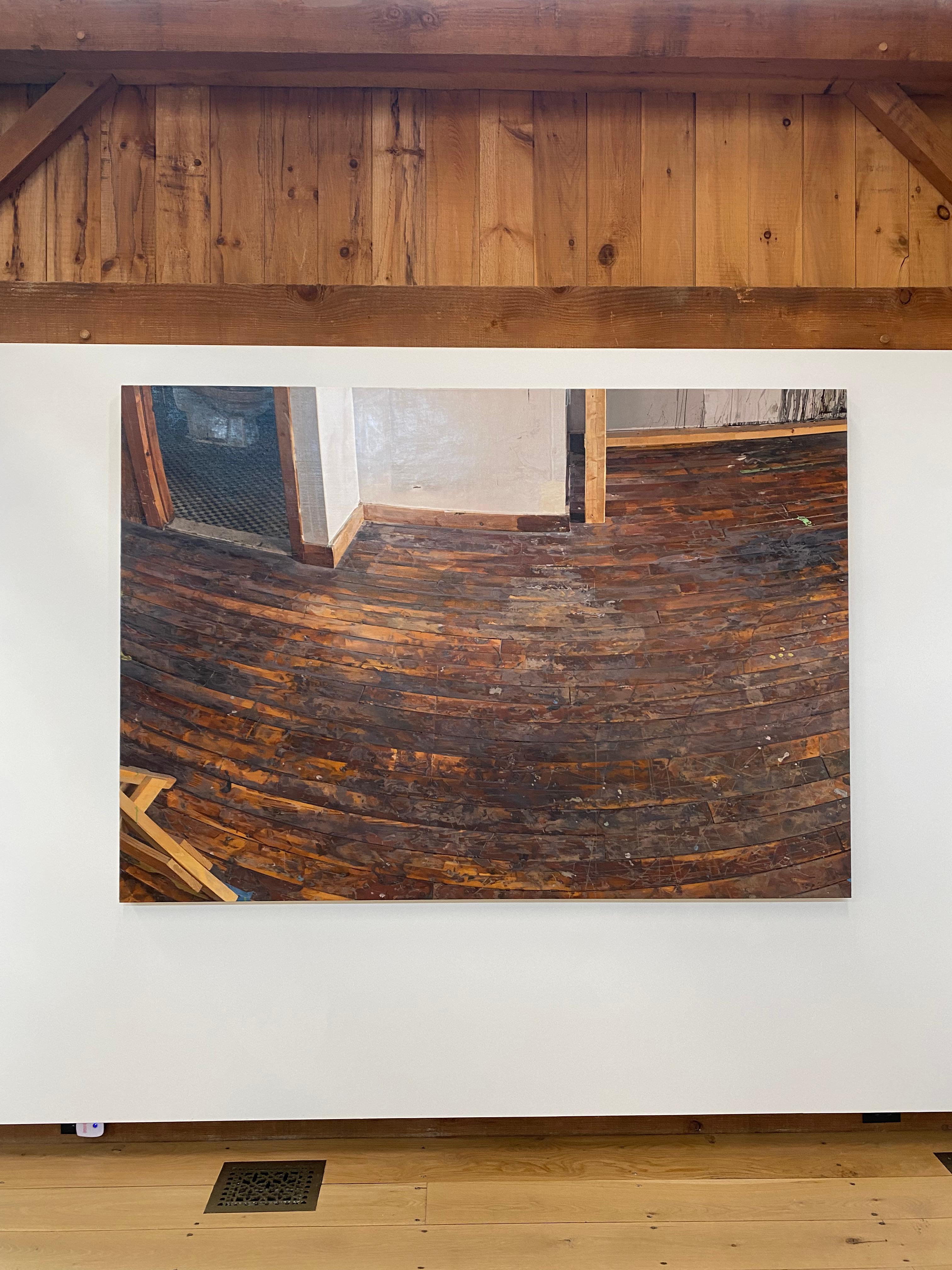 In this interior painting, the corner of a bathroom is slightly visible through the doorway along a white wall in an artist's quiet studio space. The warmth of the worn, paint splattered dark umber brown hardwood floor is masterfully painted with
