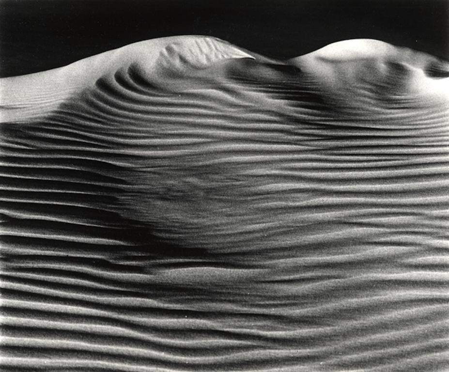 BRETT WESTON (1911-1993) 
Dunes, Oceano, 1967 
Gelatin silver print.
10 x 13 in. (25.4 x 33 cm)
Signed in pencil on the mount;
From his daughters collection Erica Weston.