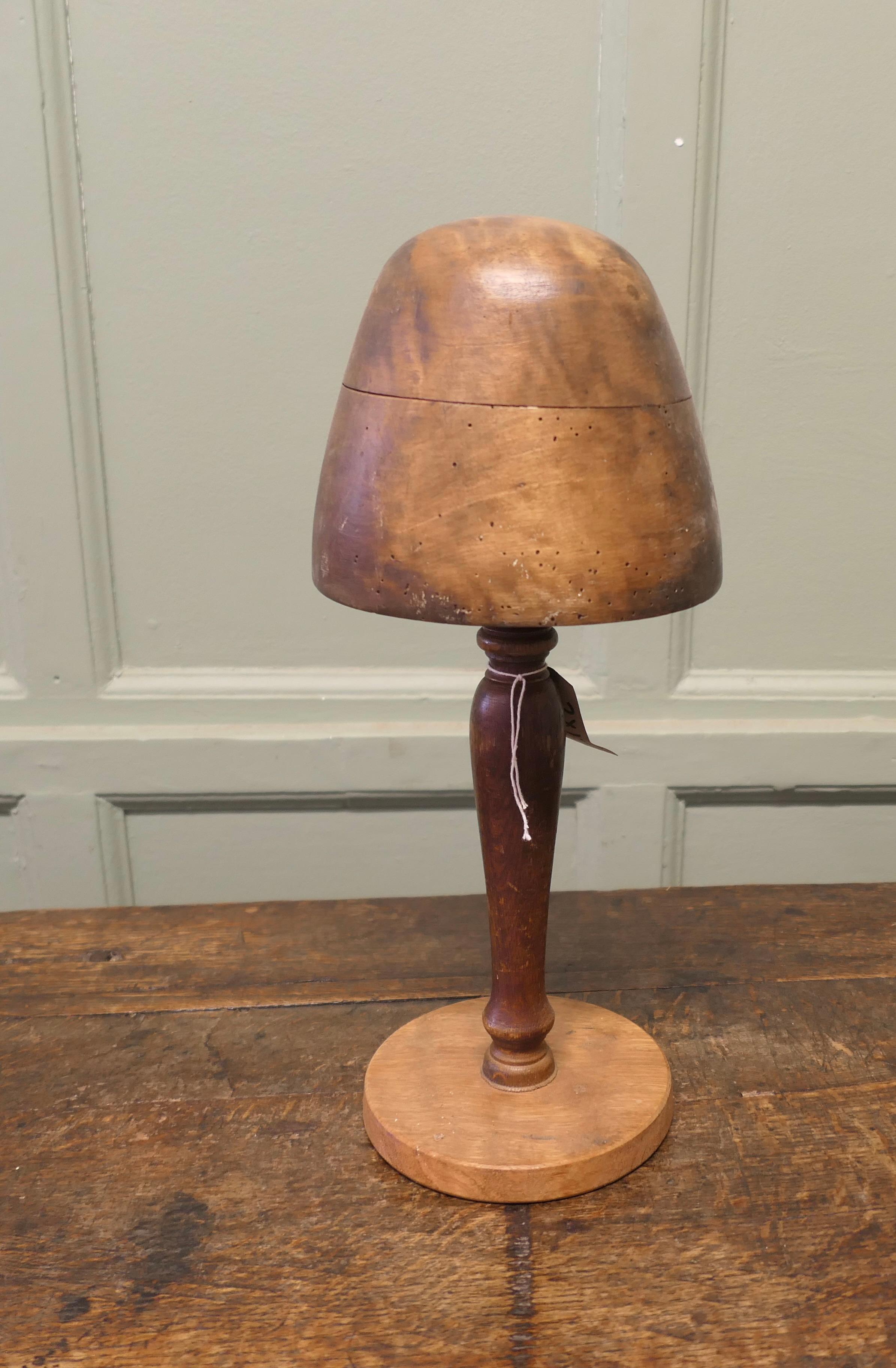 Bretton Oak and Walnut Milliners Hat Form
This is the Hat Block of a French Lace Cap much worn in the Bretton Region of France it  is a superbly smooth shape and very attractive piece,  the hat form is made in walnut on an oak stand

The Block is in