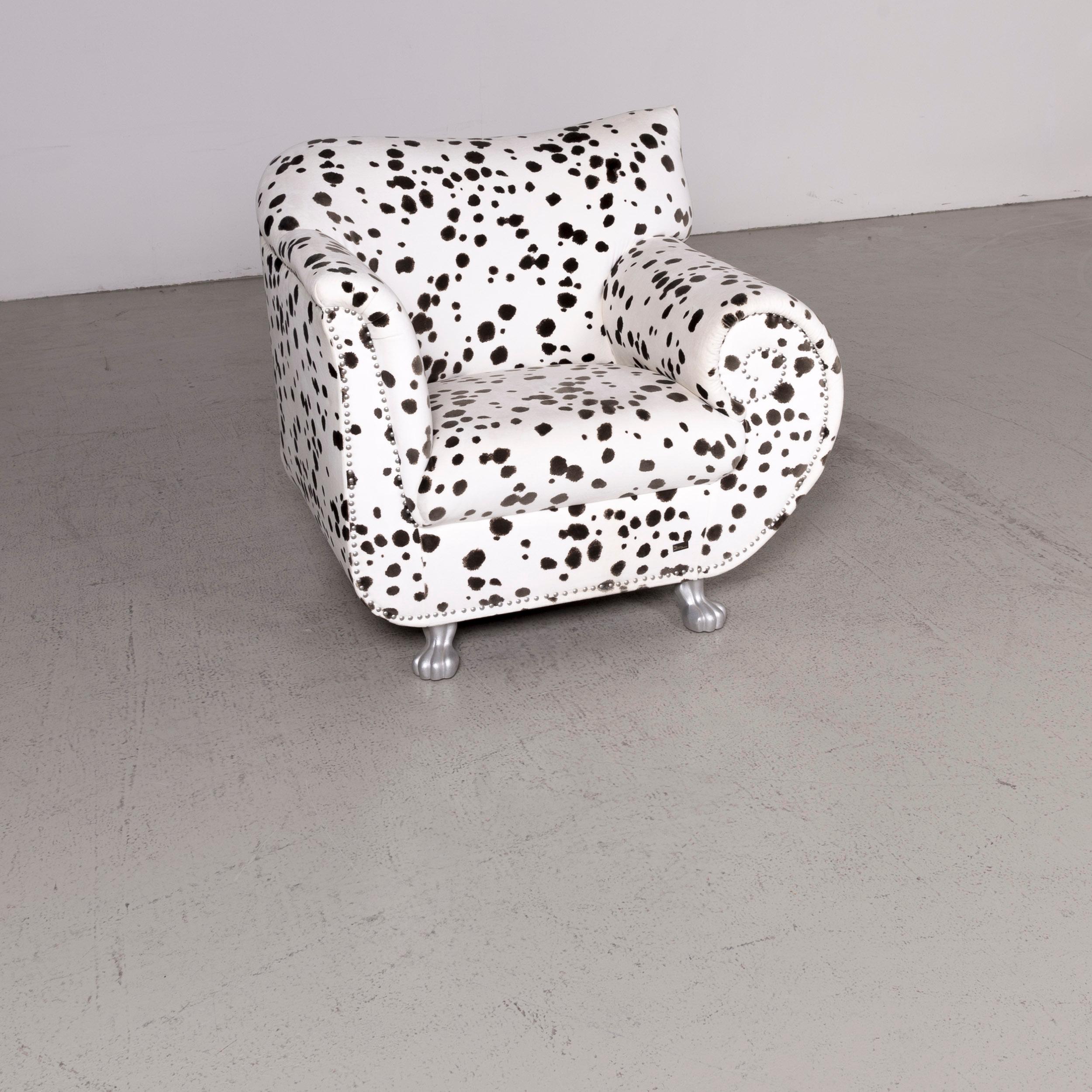 We bring to you a Bretz Gaudi designer fabric armchair white Dalmatian pattern chair with stool.

Product measurements in centimeters:

Depth 80
Width 100
Height 90
Seat-height 45
Rest-height 65
Seat-depth 50
Seat-width 50
Back-height
