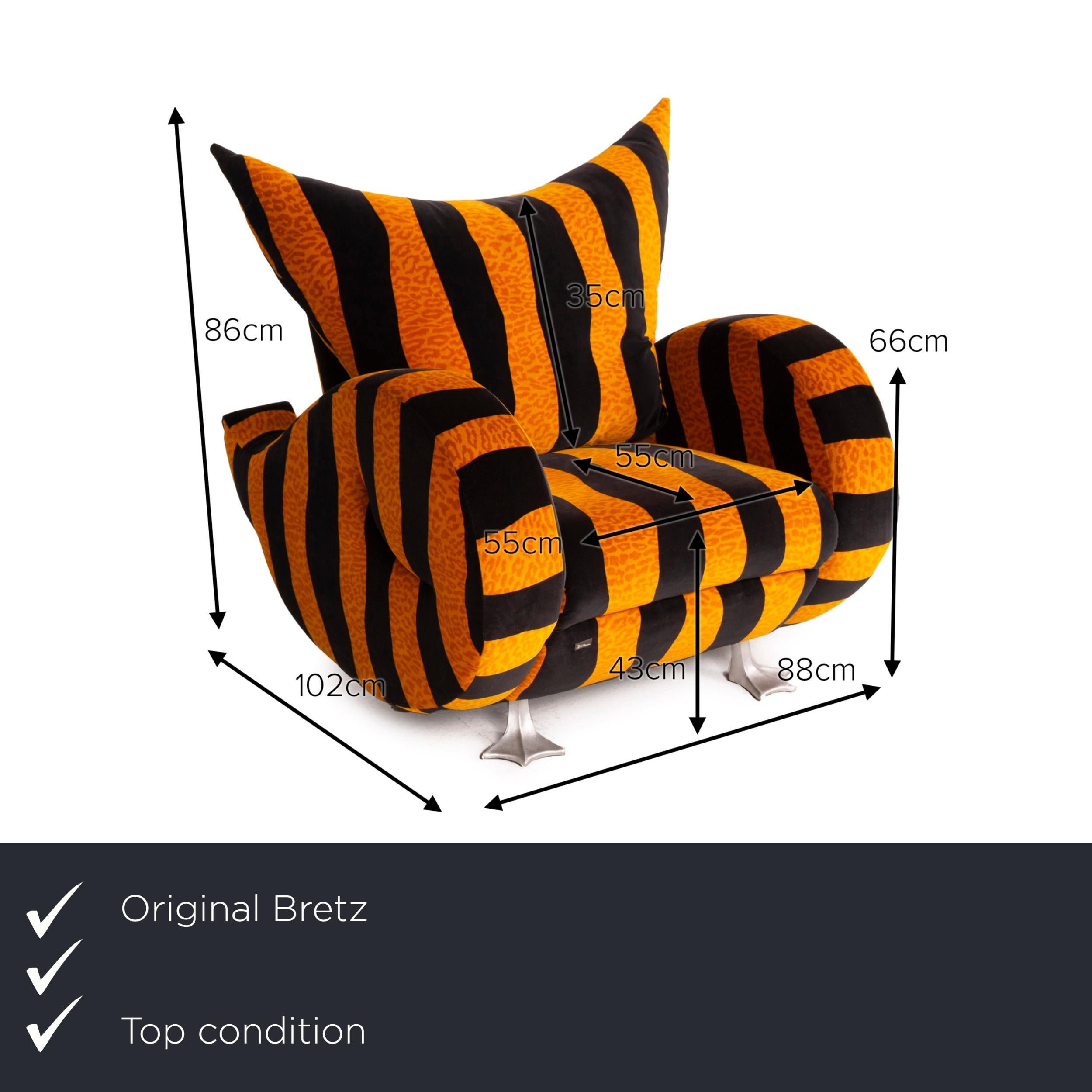 We present to you a Bretz Knastente fabric armchair yellow black tiger pattern.
  
 

 Product measurements in centimeters:
 

 depth: 102
 width: 88
 height: 86
 seat height: 43
 rest height: 66
 seat depth: 49
 seat width: 55
 back