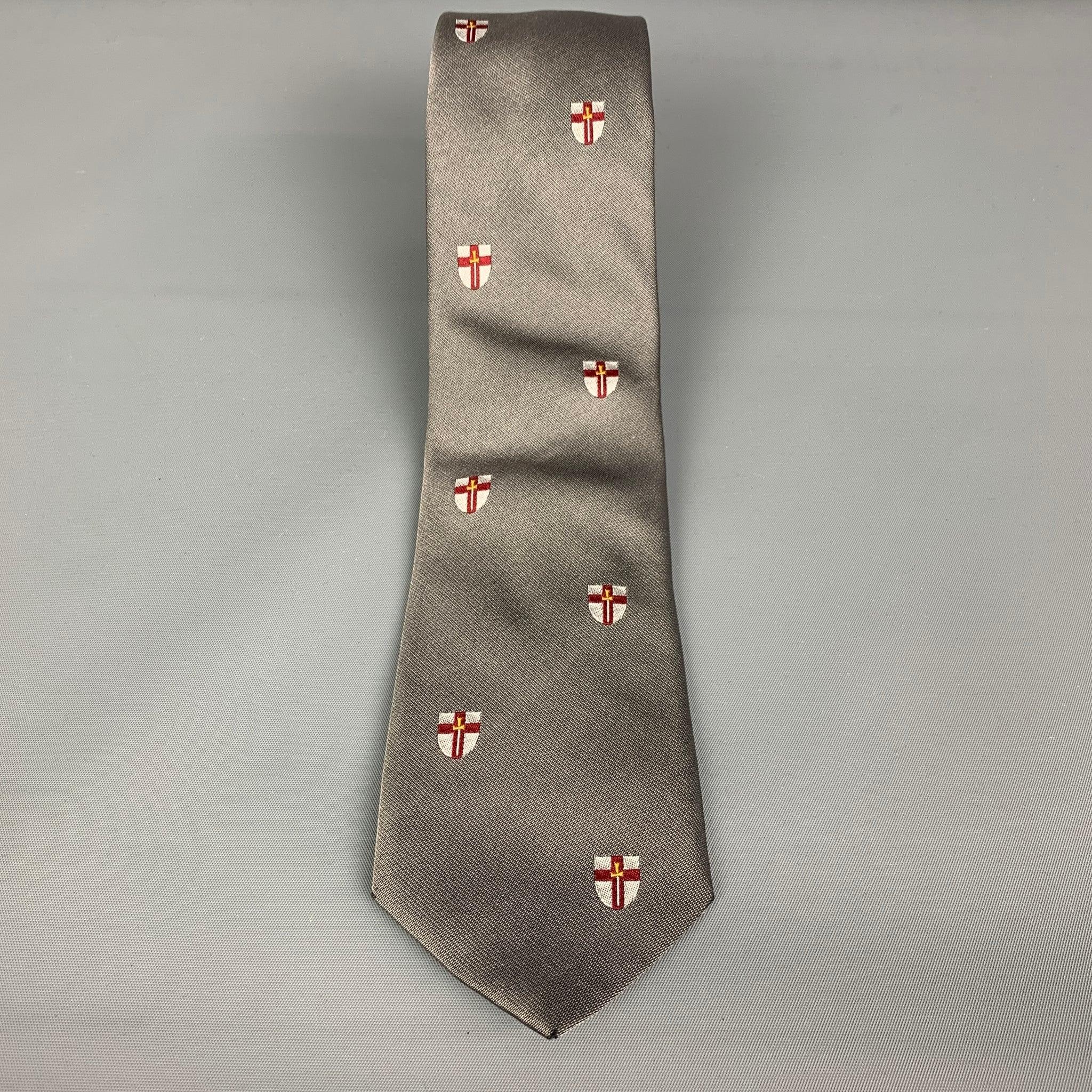 BREUER
 necktie comes in a silver silk with a all over red cross print. Good Pre-Owned Condition. As-Is.
  
 

 Measurements: 
  Width: 2.75 inches Length: 62 inches 
  
  
  
 Sui Generis Reference: 27264
 Category: Tie
 More Details
  
 Brand: