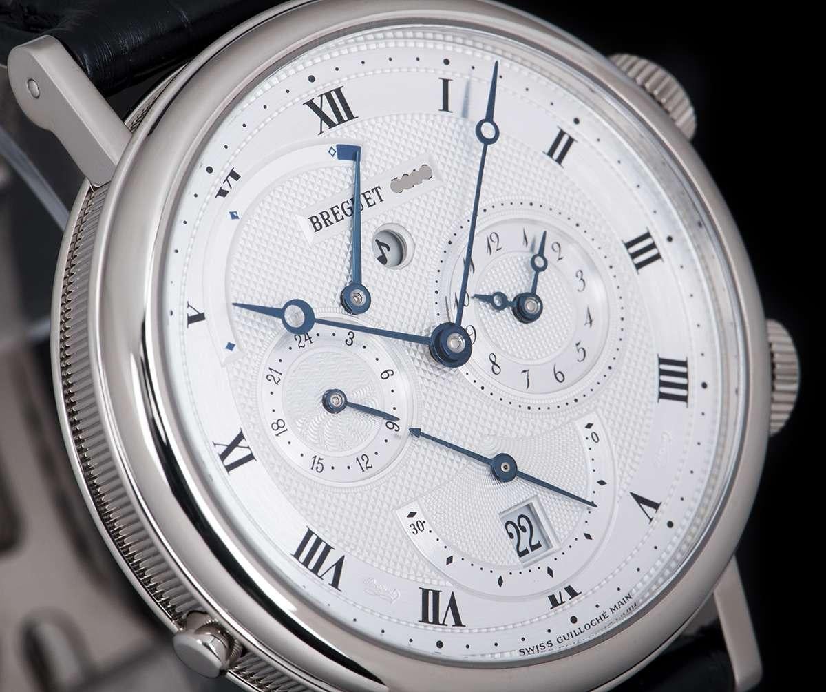 An 18k White Gold Classic Alarm Le Reveil Du Tsar Gents Wristwatch, silver dial hand engraved on a rose engine with roman numerals and a secret signature on chapter ring, alarm indicator at 3 0'clock, date and small seconds at 6 0'clock, second time