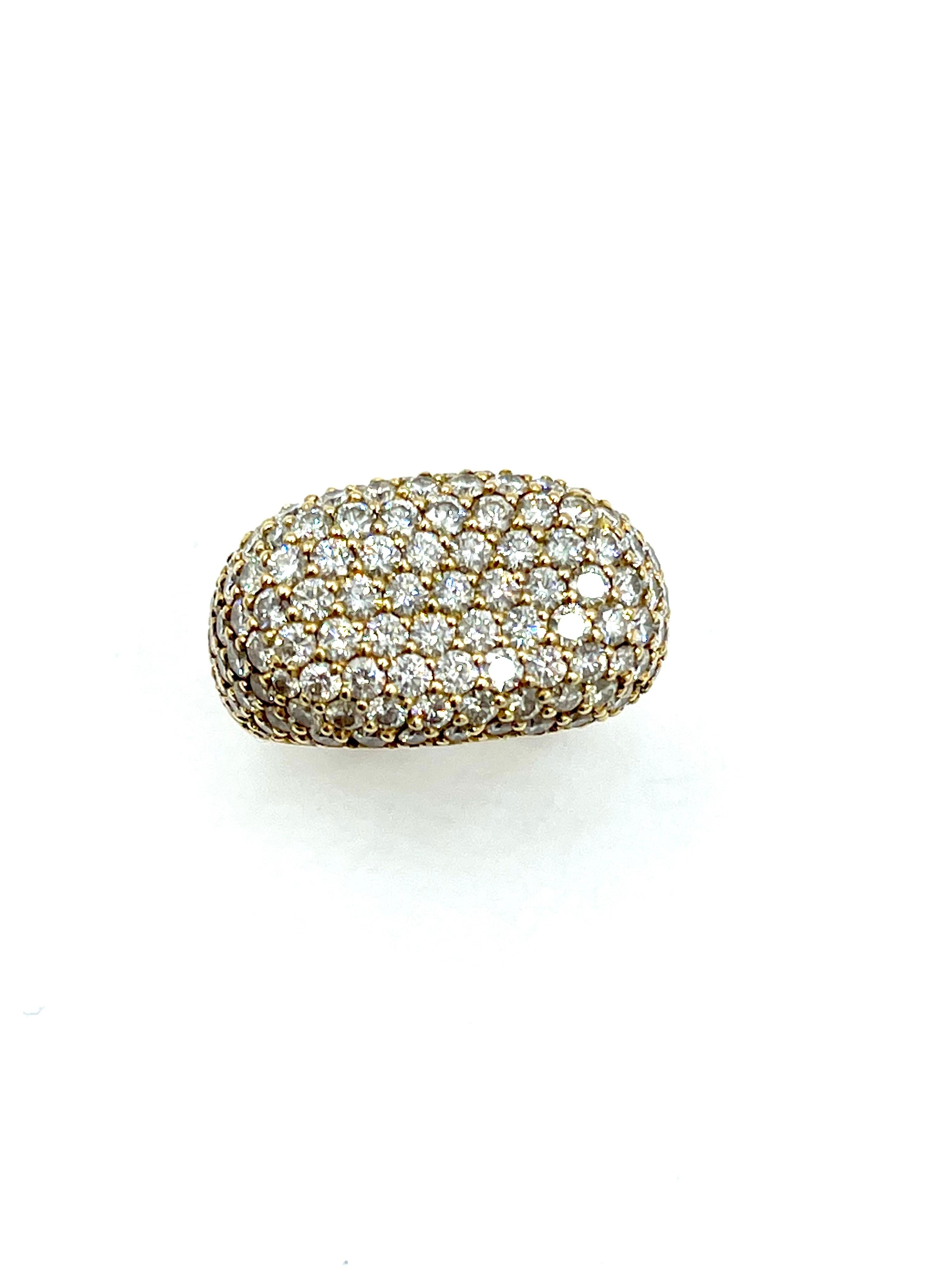 A beautiful and fiery pave Diamond ring handcrafted by Breuning.  The ring features 3.96 carats of top quality round brilliant cut Diamonds set in 18K yellow gold.  The ring has a flat pave Diamond top, with the Diamonds continuing halfway down the