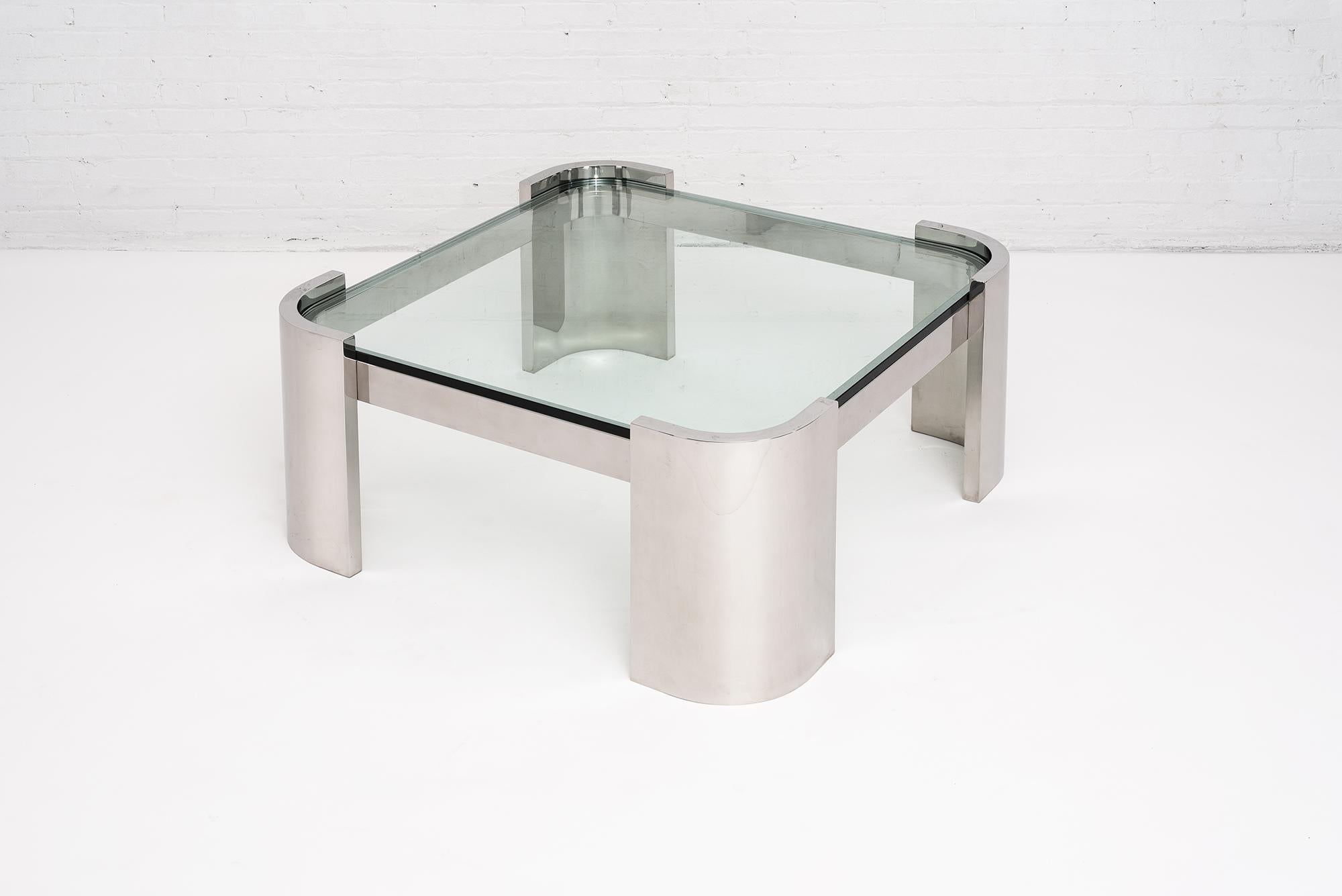 Brueton polished stainless steel and glass top coffee table, circa 1970. Stainless steel with 3/4” glass top. Heavy stainless steel construction that Brueton is known for. Polished chrome finish.