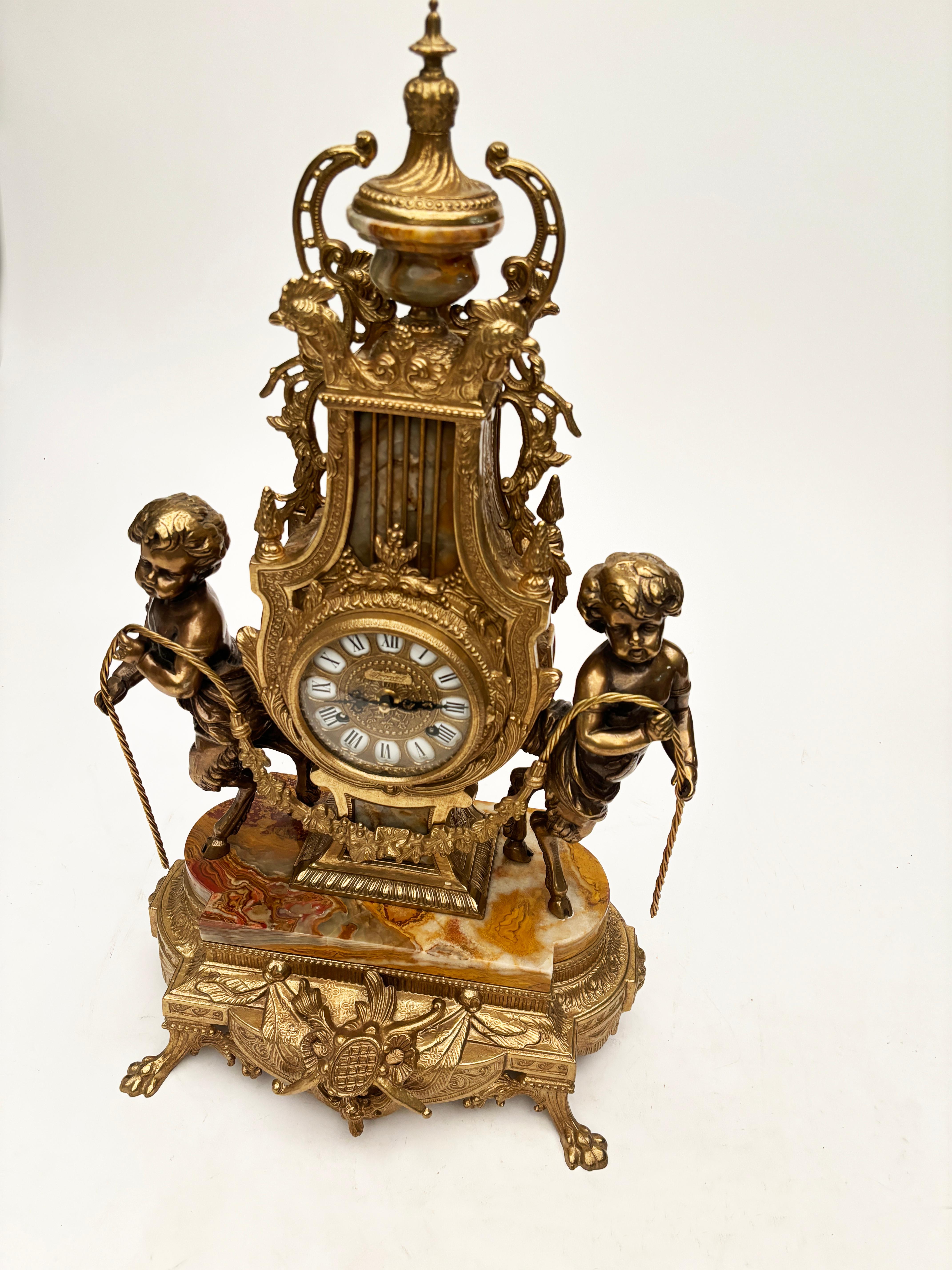 Rococo Brevettato Brass and Marble Italian Clock and Candelabras For Sale