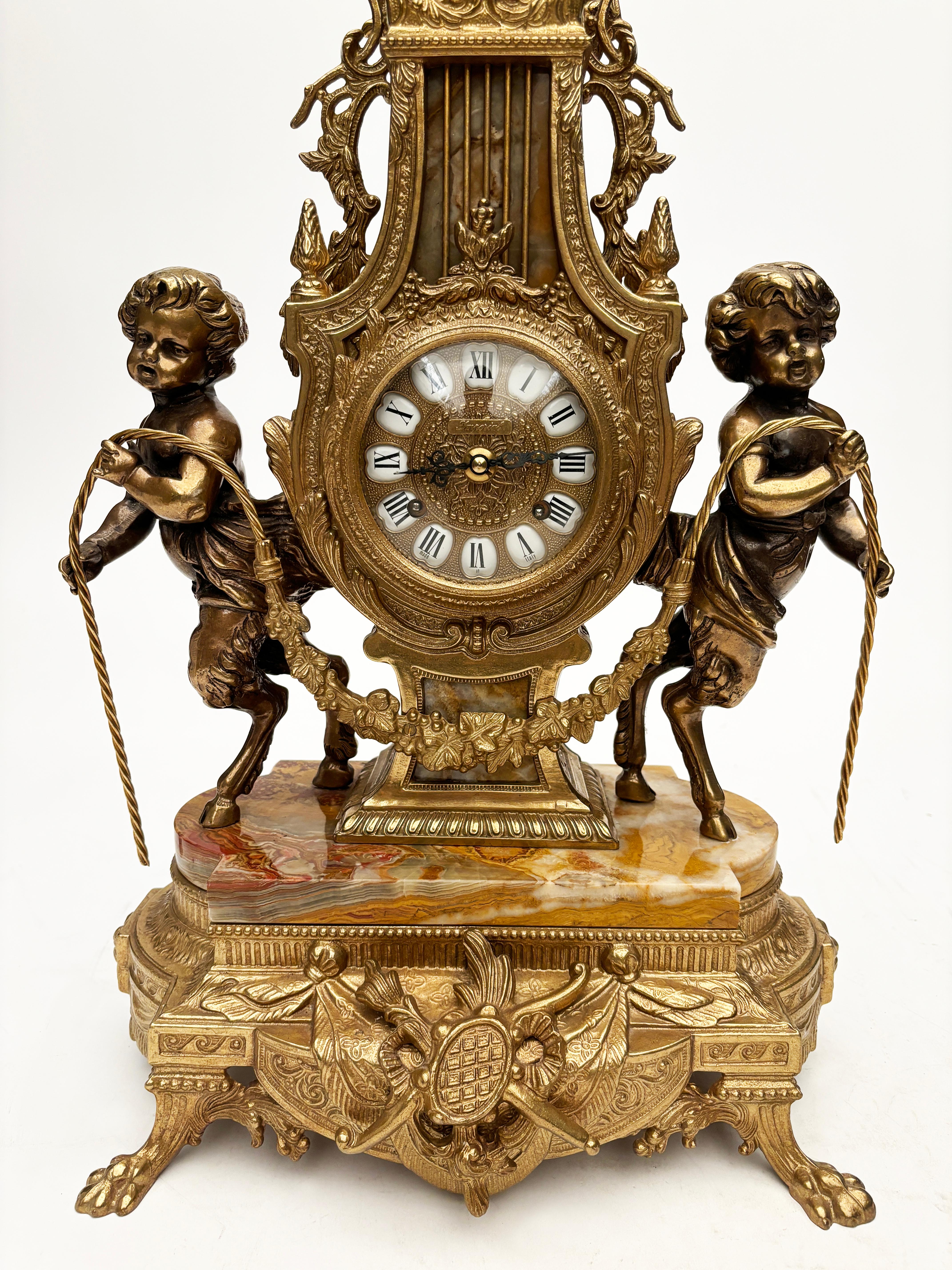 Rococo Brevettato Brass and Marble Italian Clock and Candelabras For Sale