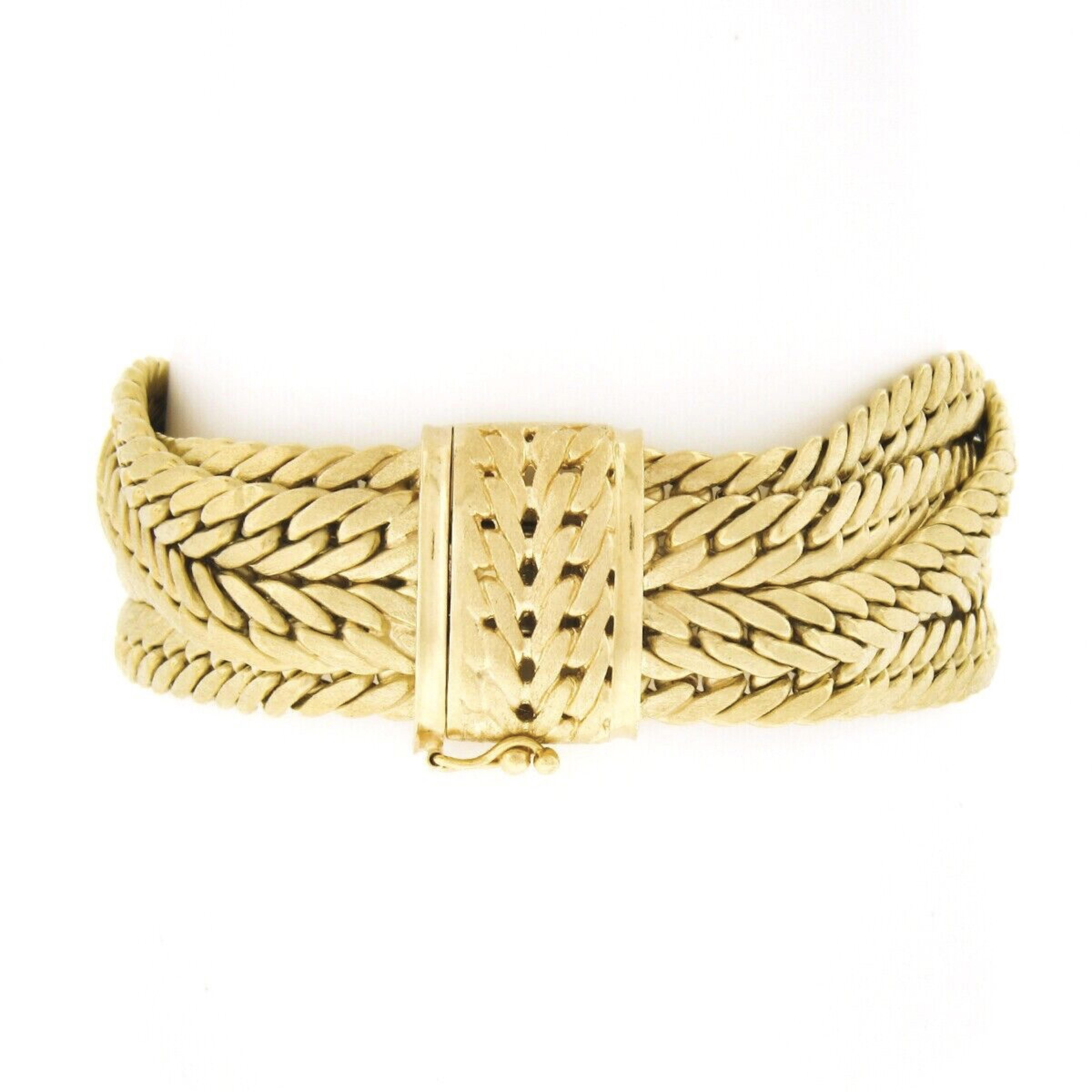 This outstanding and very well made bracelet was crafted in Italy from solid 18k yellow gold and designed by Brevetto. This wide bracelet is constructed from 5 rows of curb/Cuban link chains that have the most gorgeous brushed finish throughout