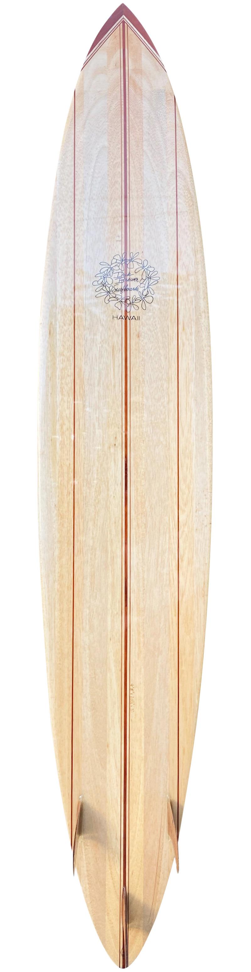 Brewer balsawood surfboard handmade by the late Dick Brewer (1936-2022). Features a 5 stringer shape design with koawood single fin, transparent Brewer plumeria logo, and 5 piece nose block. A gorgeous big wave surfboard shaped by the revered