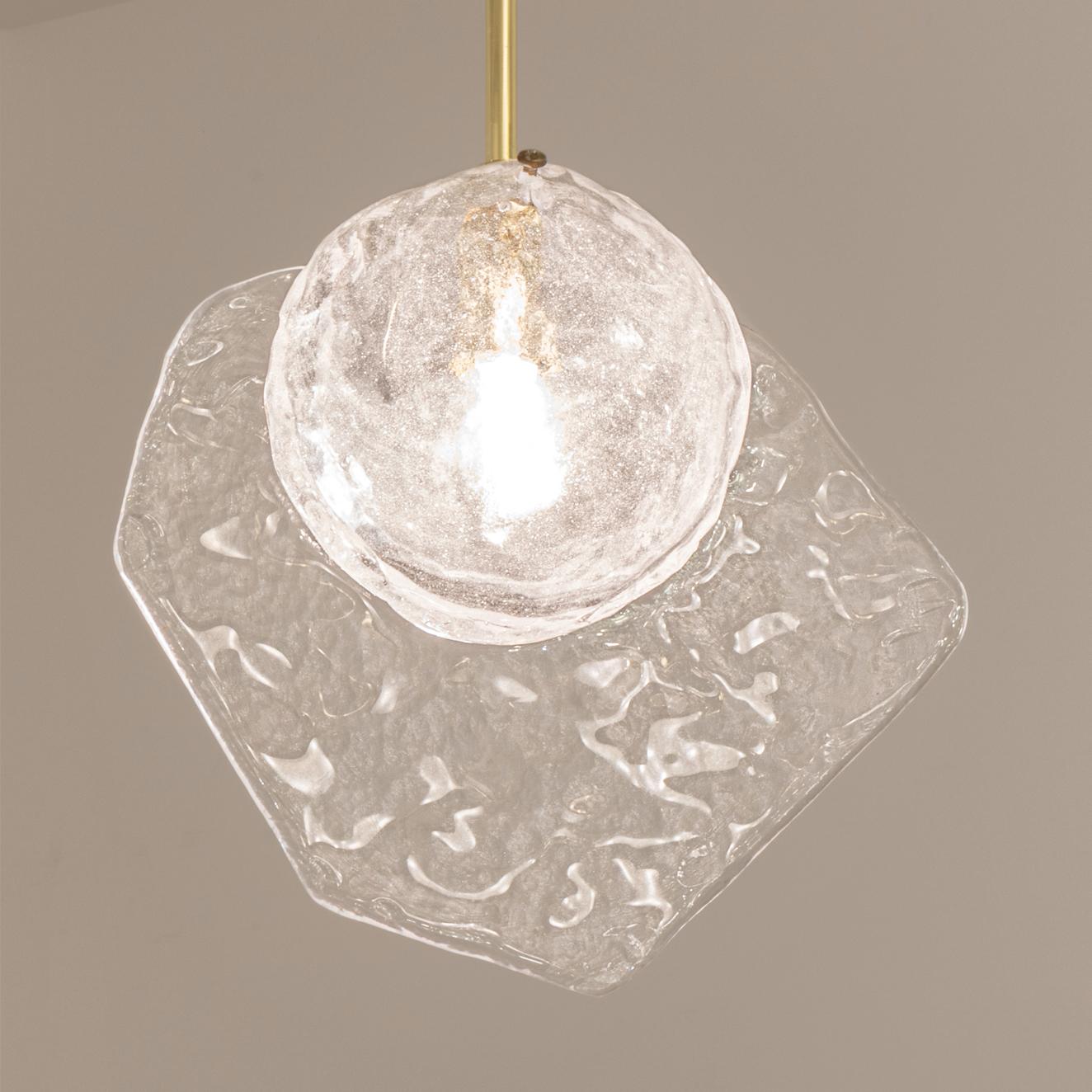Inspired by the breeze of the venetian lagoon, the Brezza pendant by form A, is constructed from hand blown Murano glass with a bubble infused core and a textured fin. Shown on a polished brass stem.

Customization options:

Each fixture is