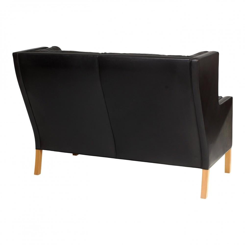 Scandinavian Modern Børge Mogensen 2 pers Coupé sofa with black patinated leather and oak wood legs