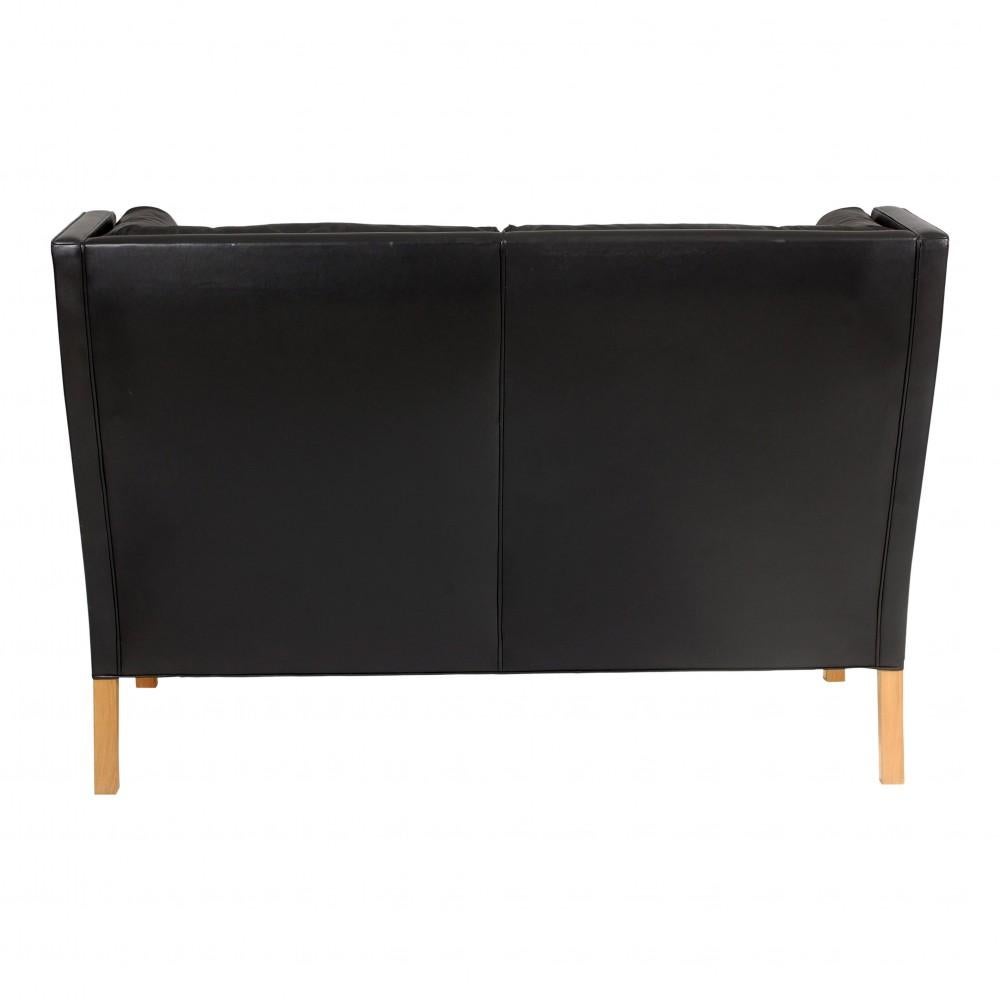 Danish Børge Mogensen 2 pers Coupé sofa with black patinated leather and oak wood legs For Sale