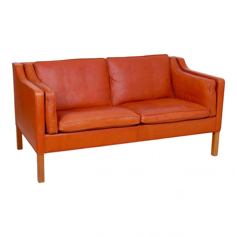 Børge Mogensen 2-seater sofa, model 2212, with original patinated cognac leather and teak legs. The sofa is from 1986 and appears with nice patinated leather.