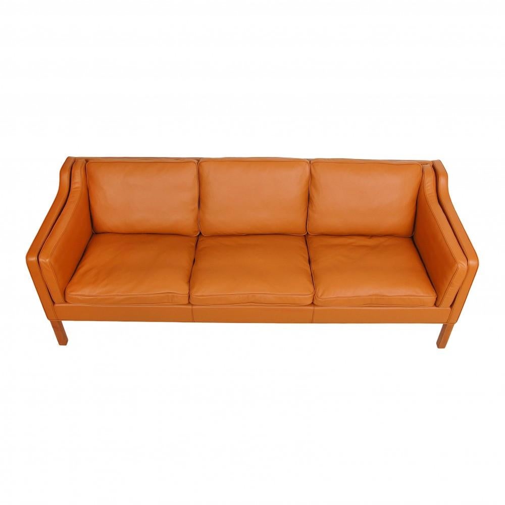 Børge Mogensen 3. seater sofa model 2213, reupholstered with cognac bison leather and mounted with new cushions. The sofa is an original produced by Fredericia Furniture, that has been reupholstered. Legs of teak.