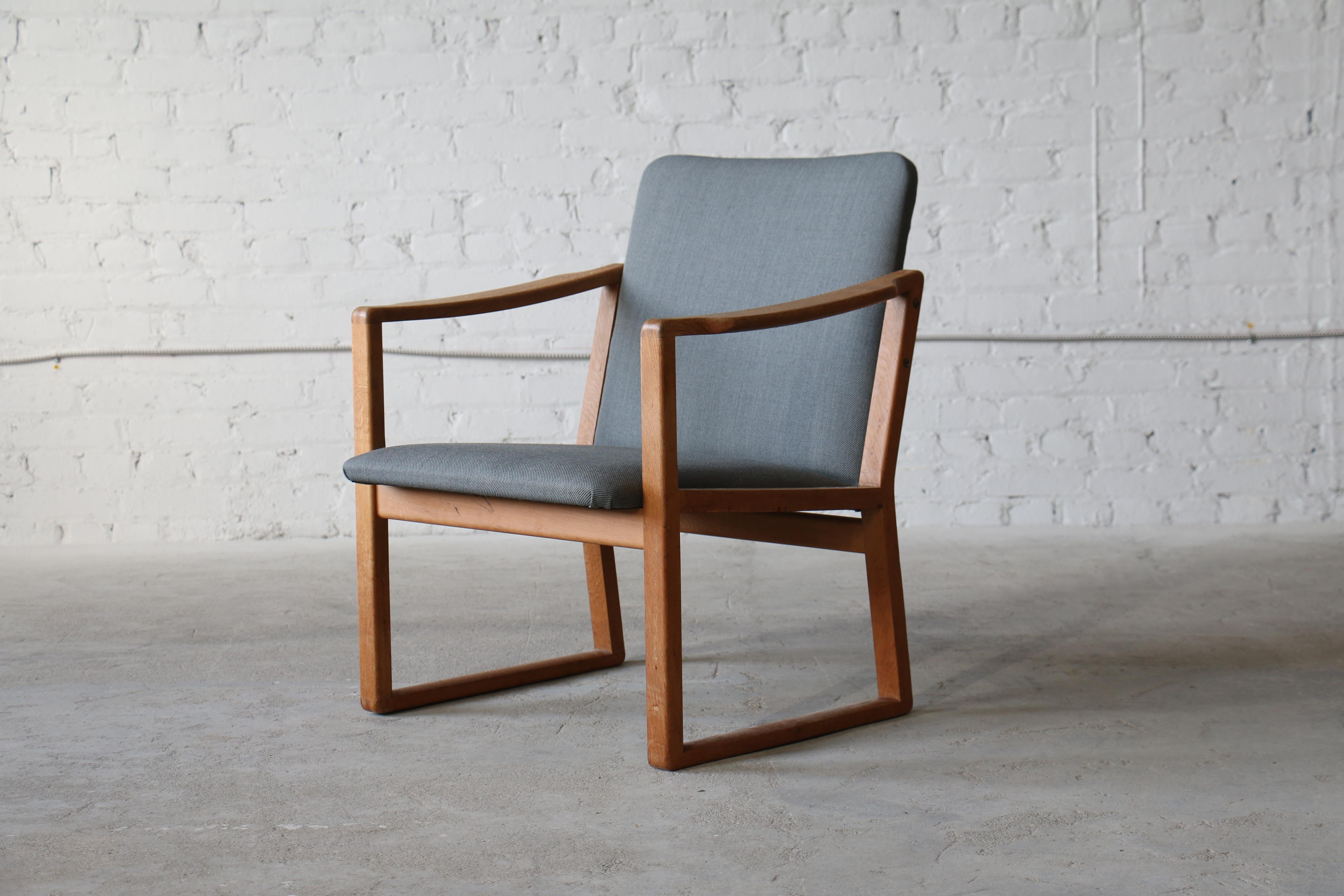 This design was manufactured by Fredericia for only a brief period making it relatively rare. The construction exhibits classic Mogensen characteristics. Notably, the sled style legs and the finger jointed armrests (and legs) which really show off