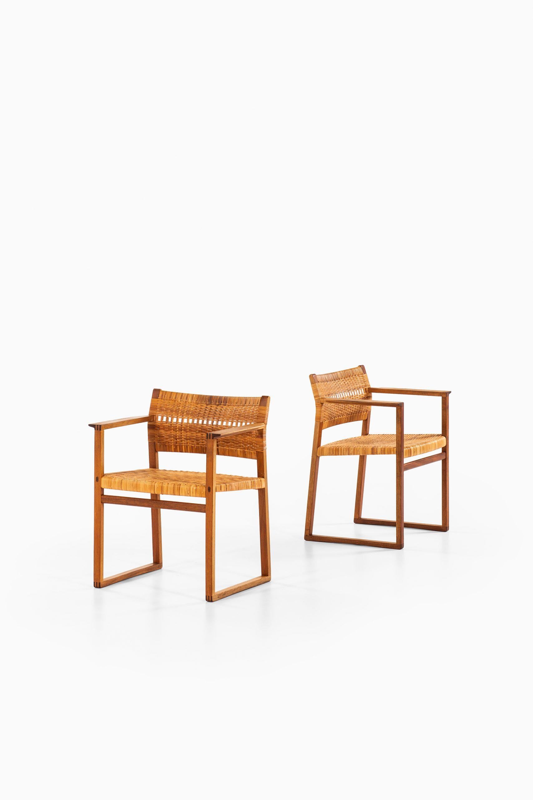 Rare pair of armchairs model BM-62 designed by Børge Mogensen. Produced by Fredericia Stolefabrik in Denmark.