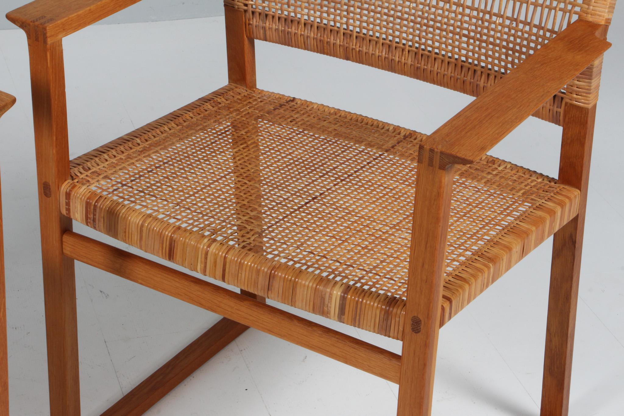 Mid-20th Century Børge Mogensen arn chairs with cane seat, oak, BM62