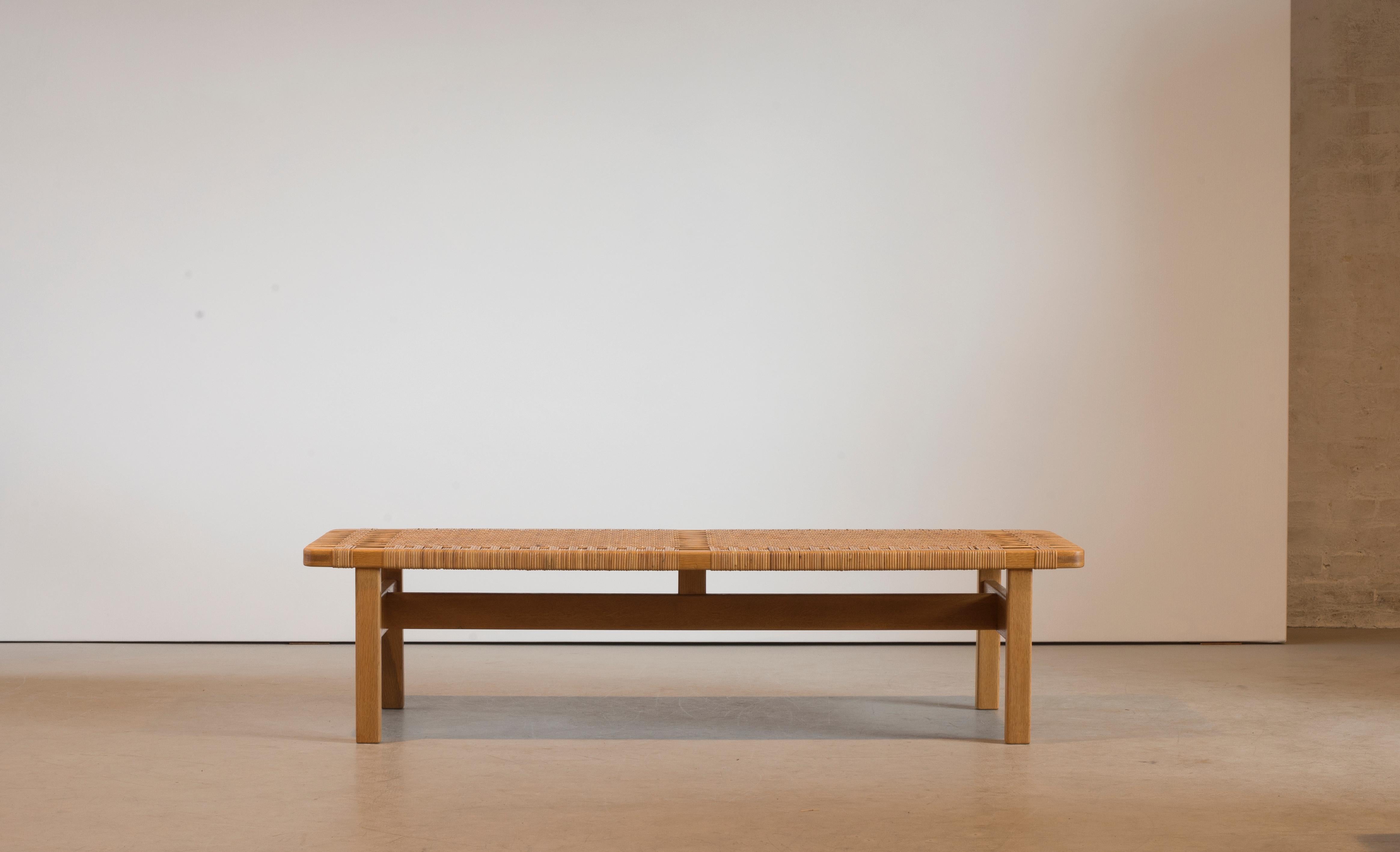 Børge Mogensen. An oak bench with top of woven cane. Manufactured by Fredericia Furniture.