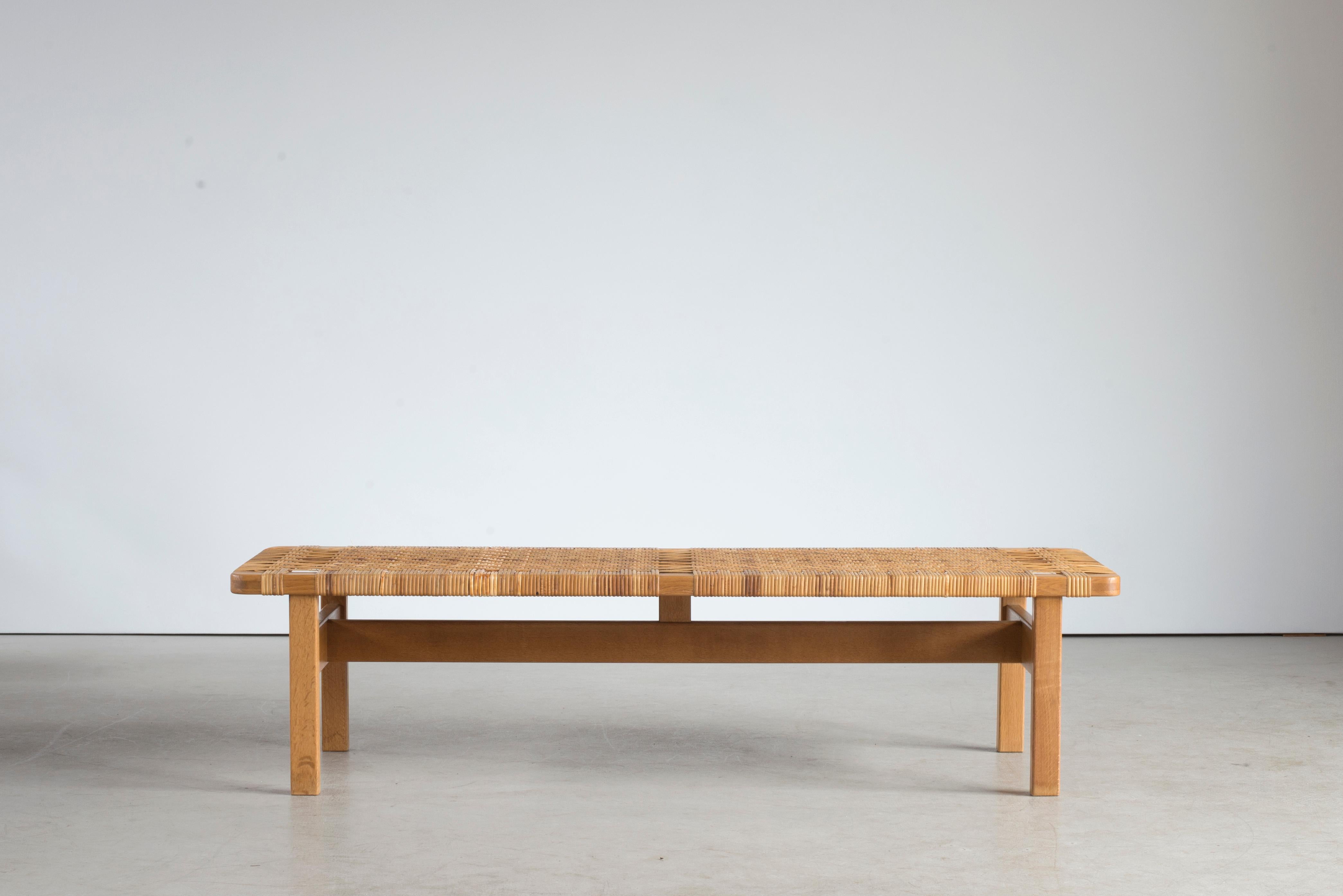 Børge Mogensen. An oak bench with top of woven cane. Manufactured by Fredericia Furniture.