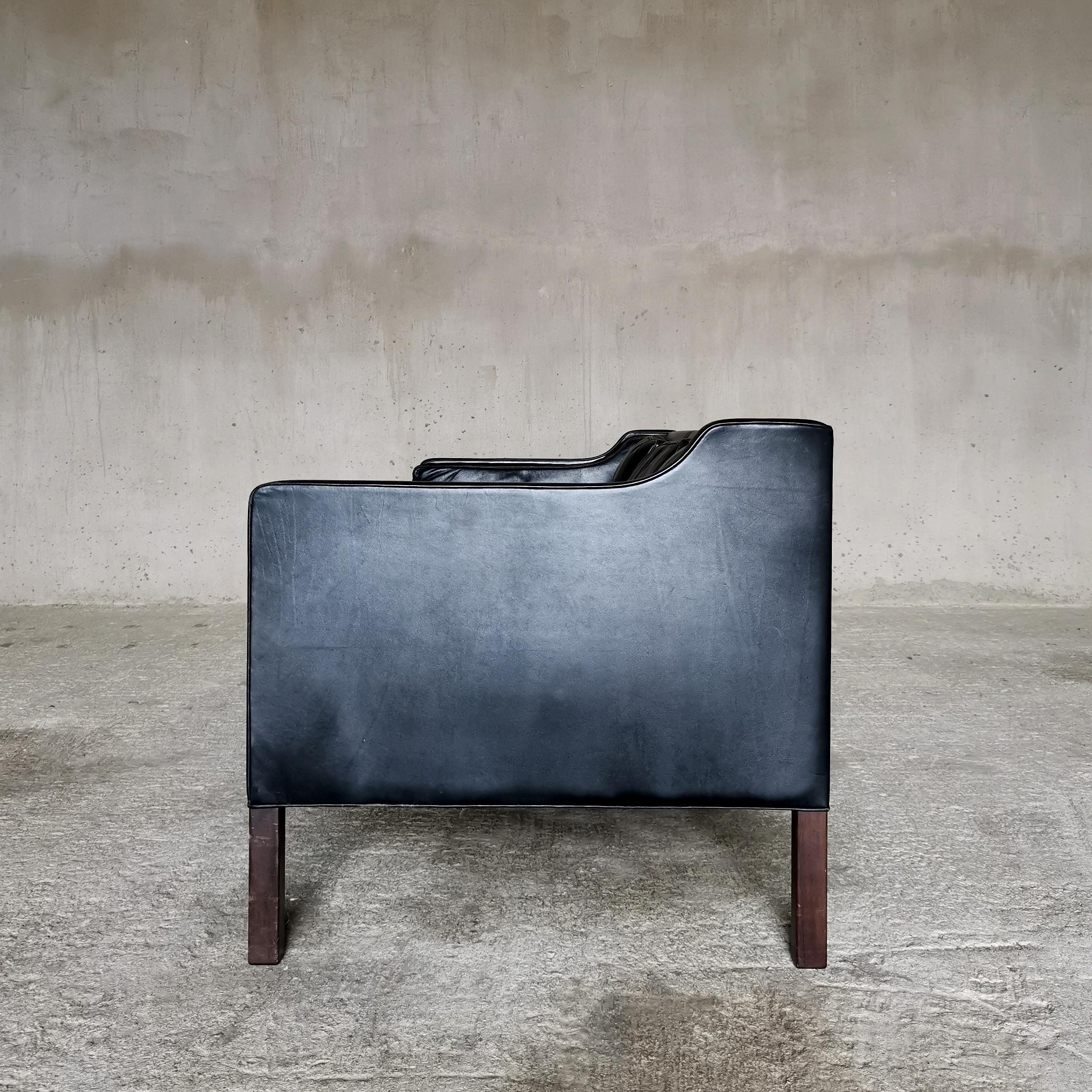 Børge Mogensen Black Leather 3 seat Sofa Model 2213
With original patinated black leather upholstery.
Produced by Fredericia Furniture, Denmark 1960s
Dark stained beech legs
Manufactures stamp

This Sofa is part of at set of three items, consisting