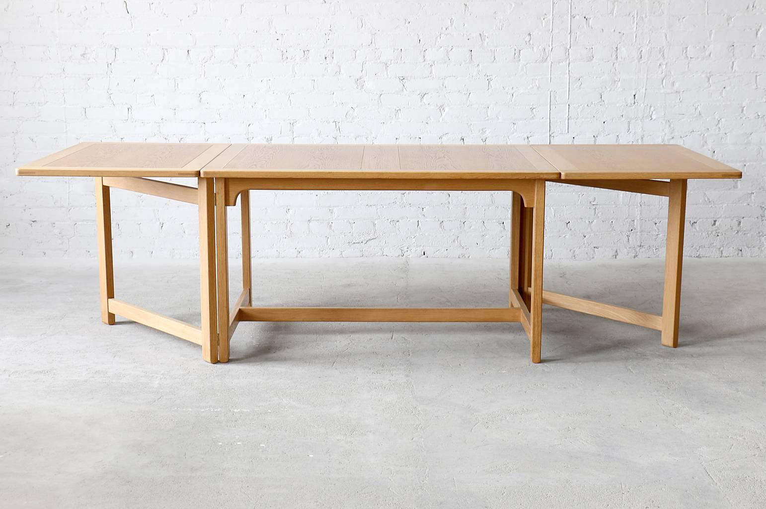 A Classic gateleg/dropleaf table designed by Børge Mogensen for Fredericia. Impressive solid oak frame and tabletop perimeter. Could be used as a dining table or work table. 

- Model #BM71 
