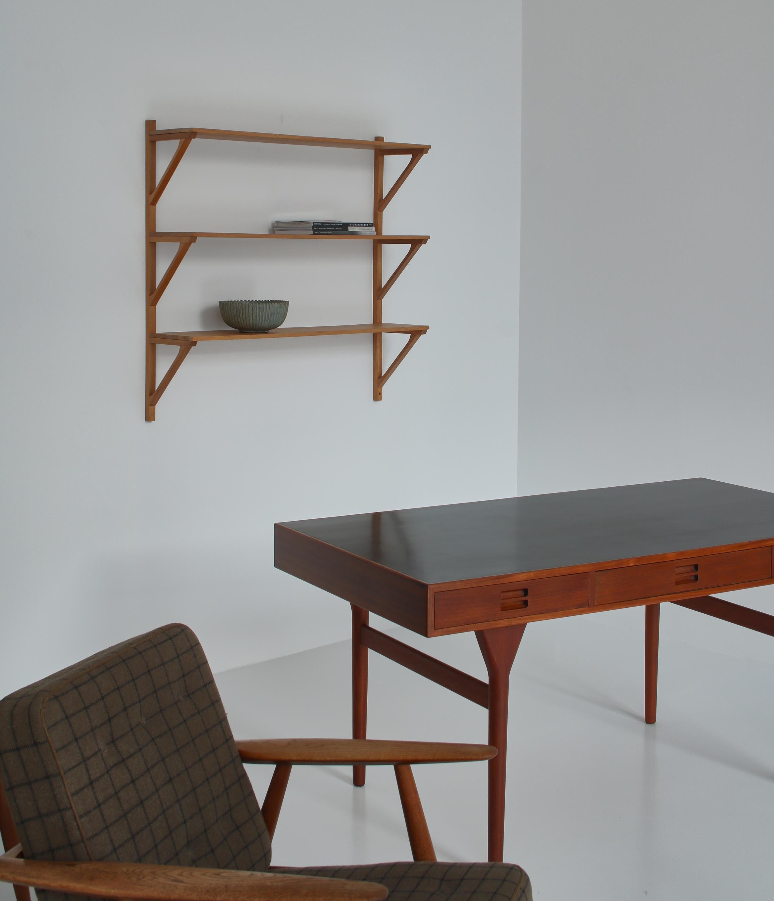 Rare and important wall shelving system in oak by Børge Mogensen made at cabinetmaker Erhard Rasmussen in 1956.