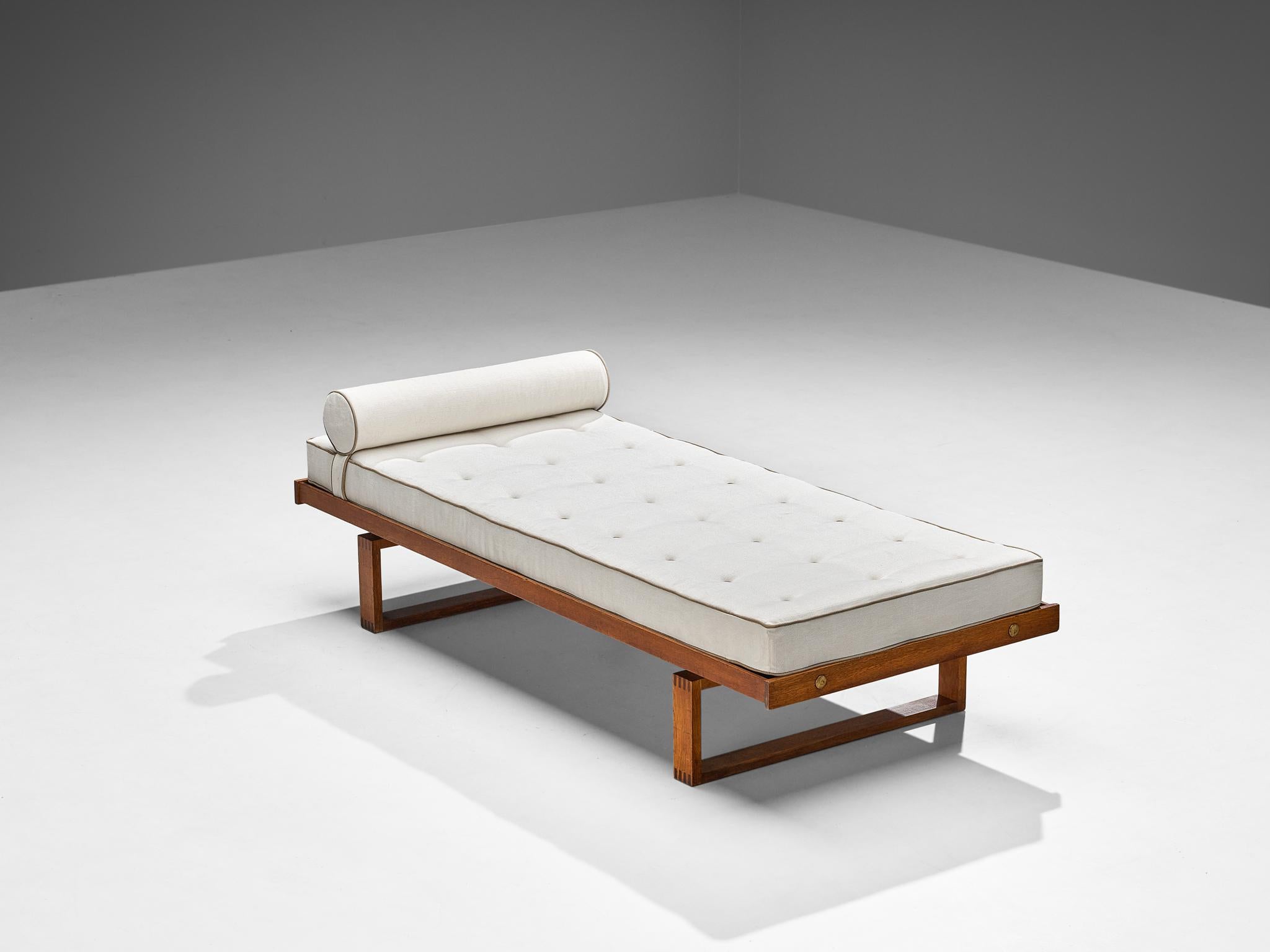 Børge Mogensen, daybed, teak, brass, Denmark, 1960s.

A simple and minimalist bed with fine wood joints designed by Danish furniture designer Børge Mogensen. The construction of this teak daybed is based on clean lines and angular shapes. Its simple