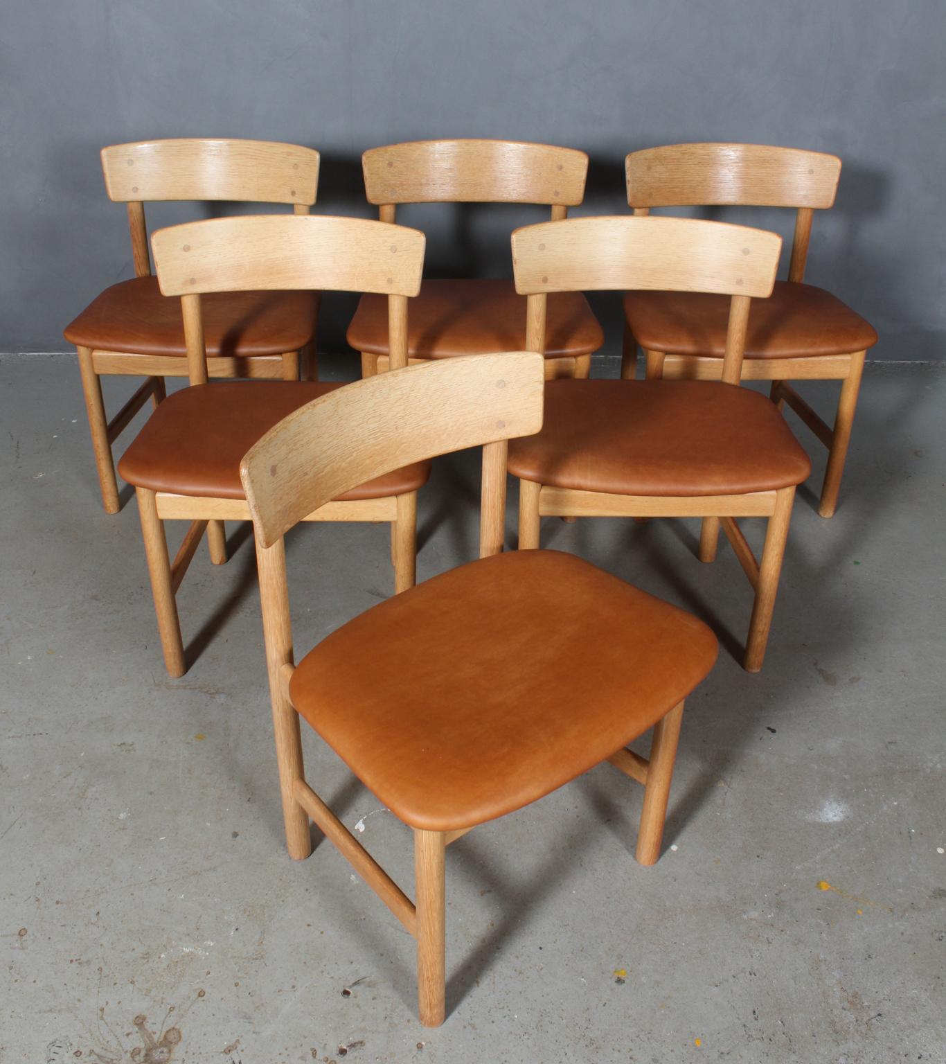 Børge Mogensen dining chairs made of massive oak and new upholstered with tan aniline leather.

Model 3236, made by Fredericia Furniture.