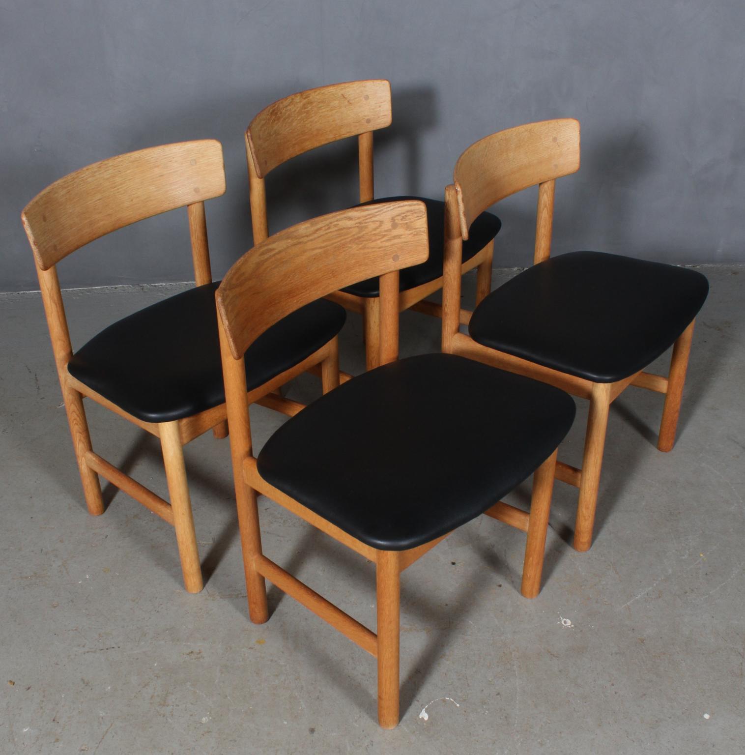 Børge Mogensen dining chairs made of massive oak and new upholstered with black aniline leather.

Model 3236, made by Fredericia Furniture.