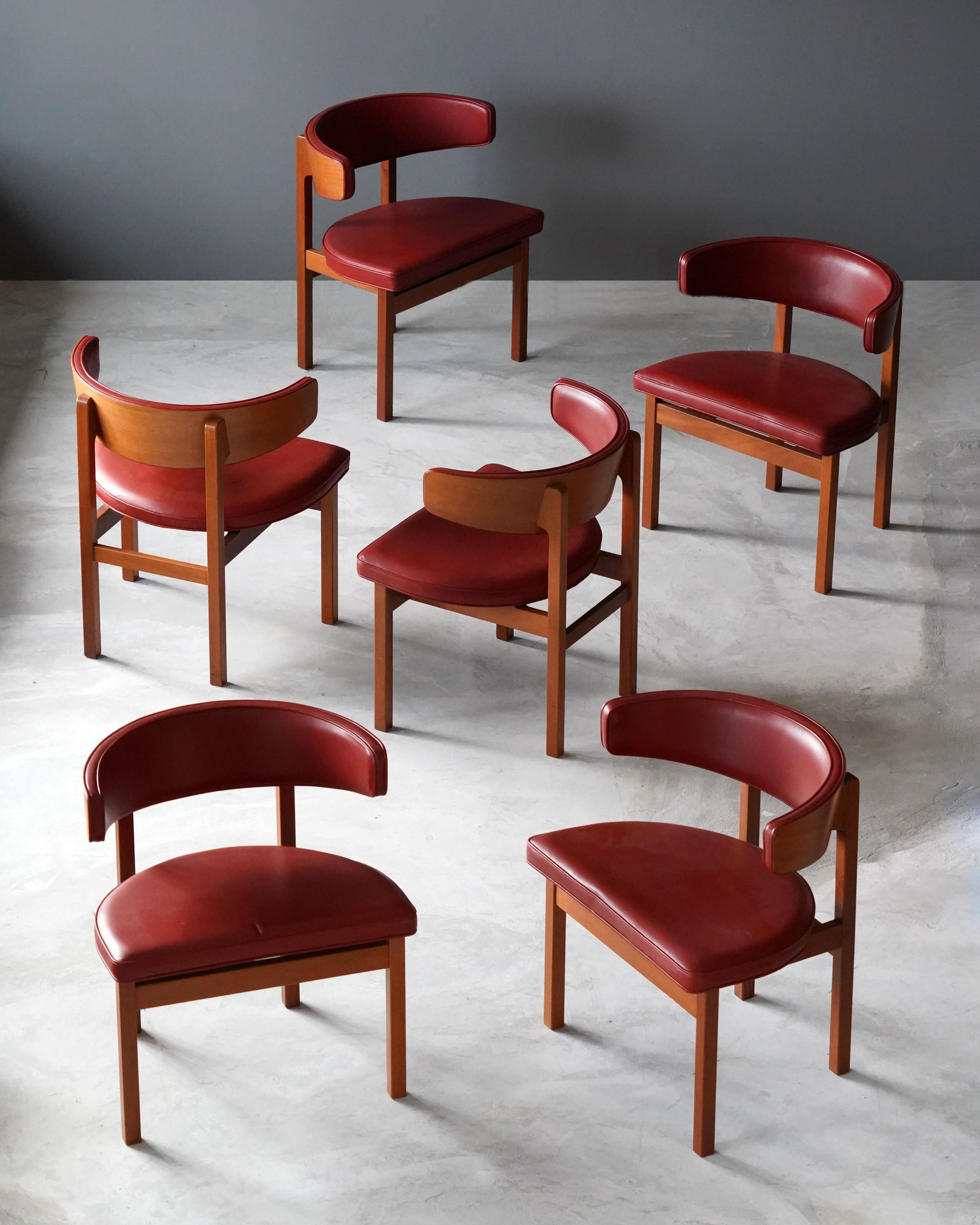 A set of 6 dining chairs / side chairs by Børge Mogensen. Designed by Børge Mogensen for Frederica Furniture, Denmark, 1960s. Labeled.

In original red leather, solid oak. 

Other designers of the period include Kaare Klint, Arne Jacobsen, Ole