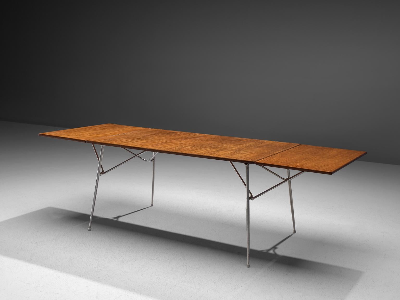 Børge Mogensen for Søborg Møbler, dining table or desk, teak and steel, Denmark, 1953.

Drop leaf teak dining table by Børge Mogensen for Søborg Møbelfabrik. Rarely did Mogensen use steel as a featured material for his designs but with this