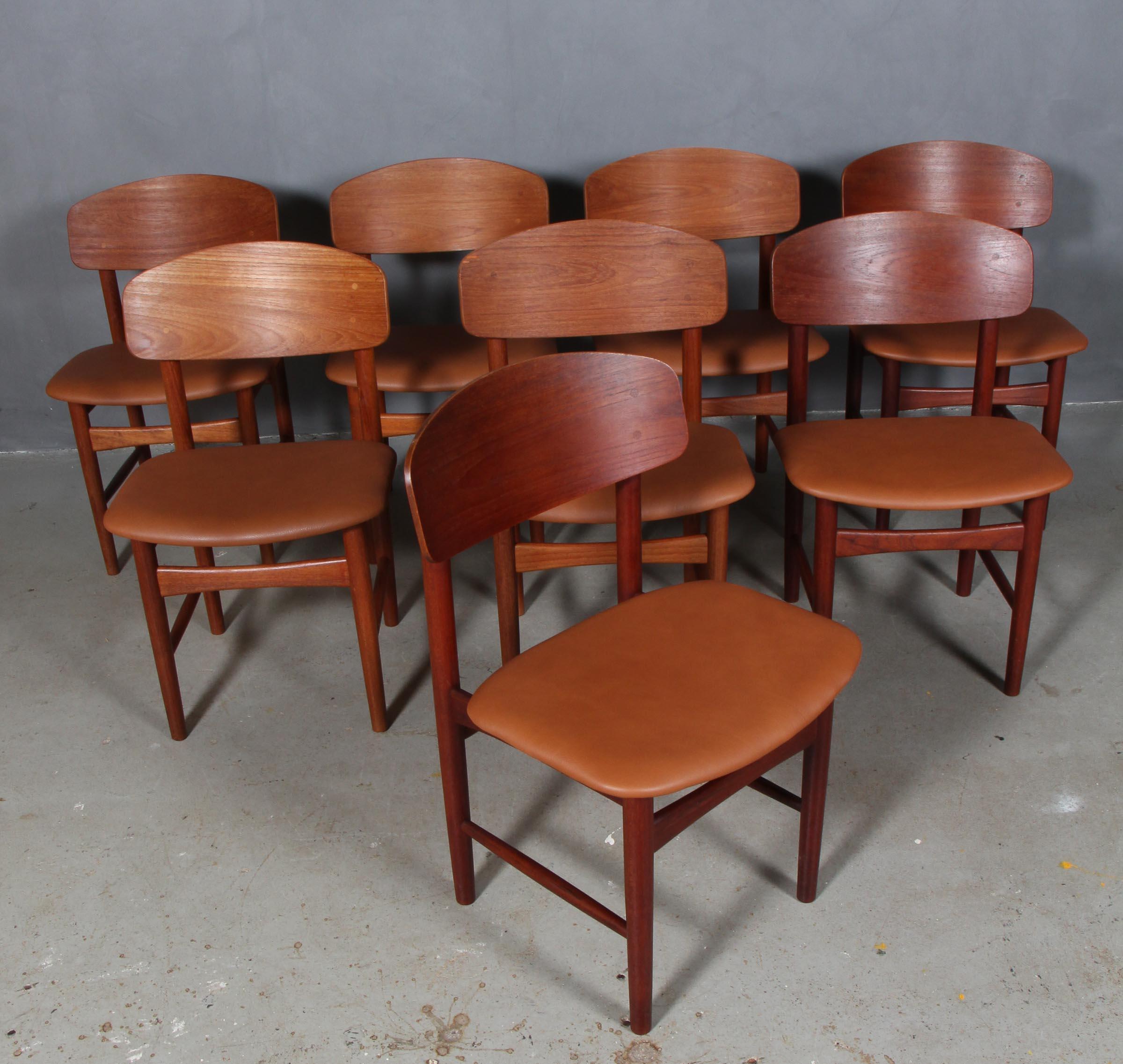 Børge Mogensen eight dining chairs. Partly solid teak.

New upholstered with cognac aniline leather.

Model 122, made by Søborg Møbler.
